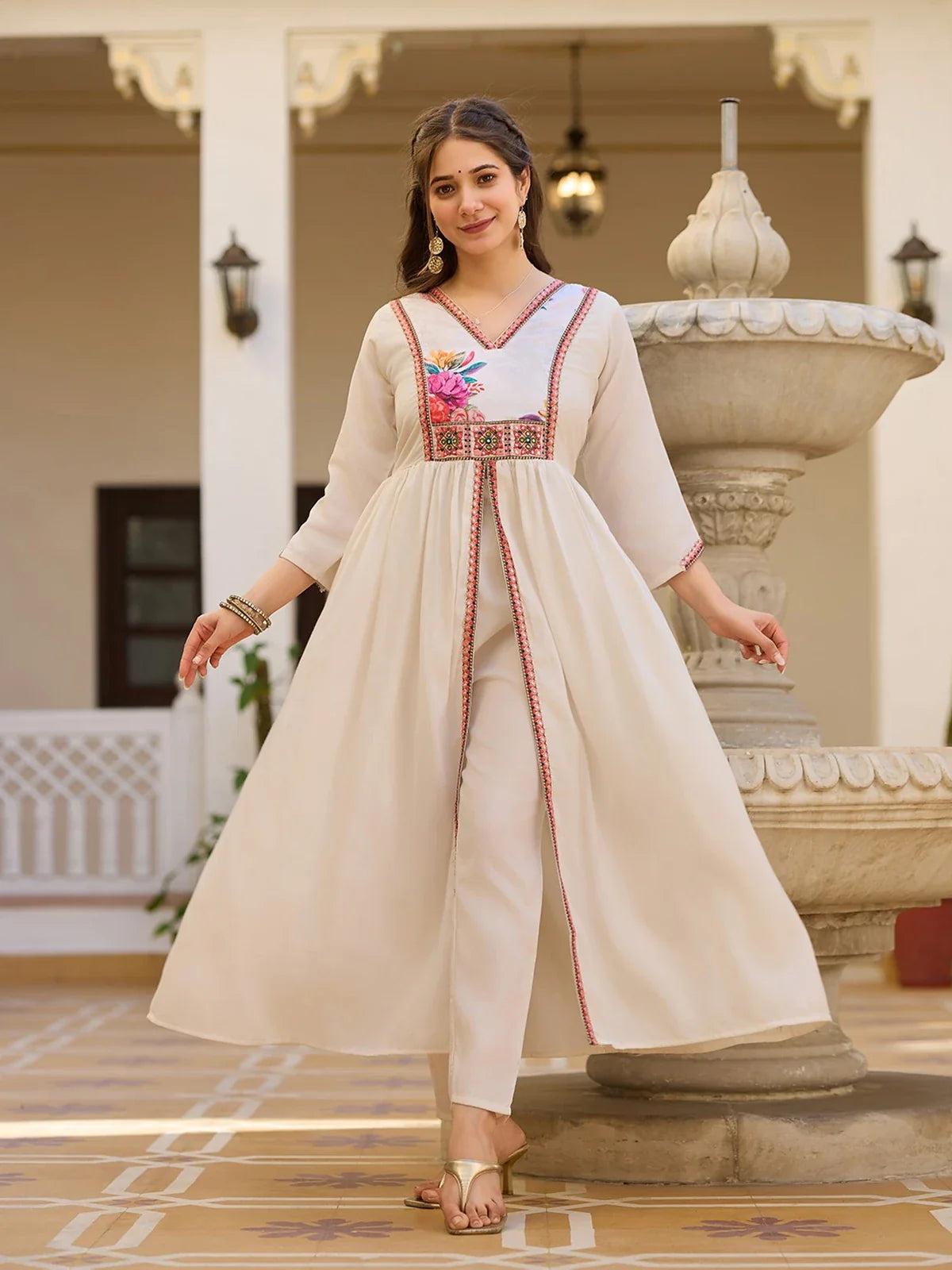 Tarani off white silk dress in front pose showing long silhouette and embroidery