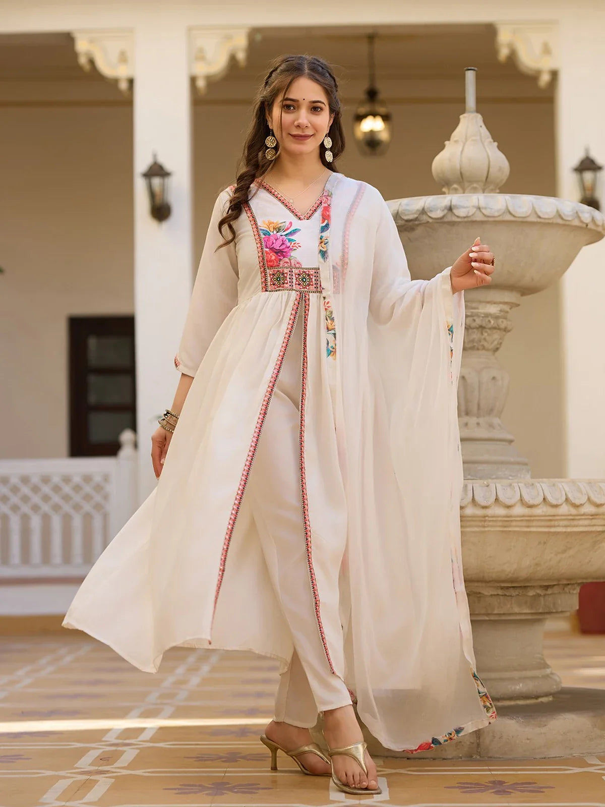 Tarani off white silk dress with floral embroidery work captured in full view for festive and wedding occasions