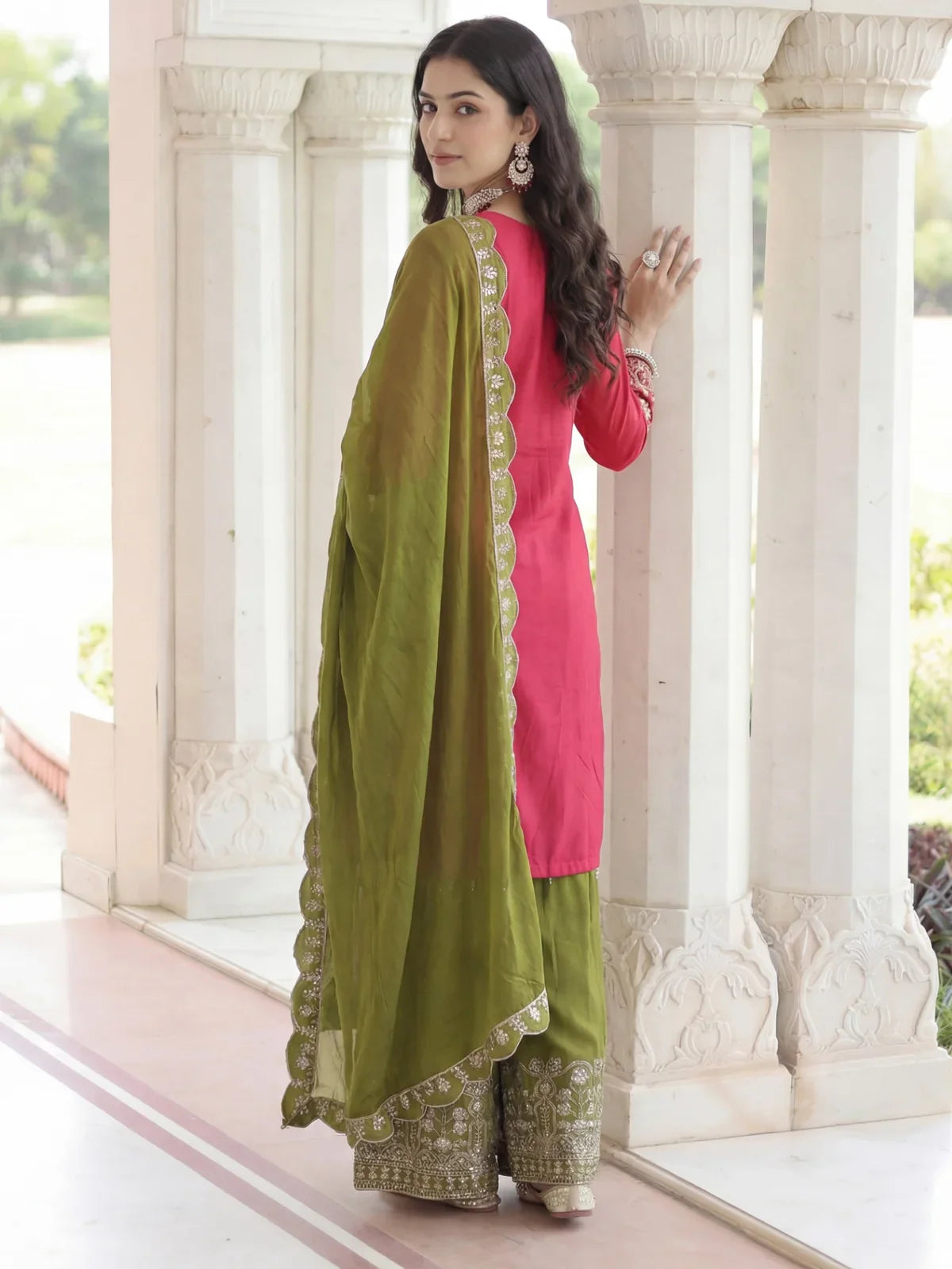 Tarani designer back view of pink and green dress with dupatta drape and intricate detailing