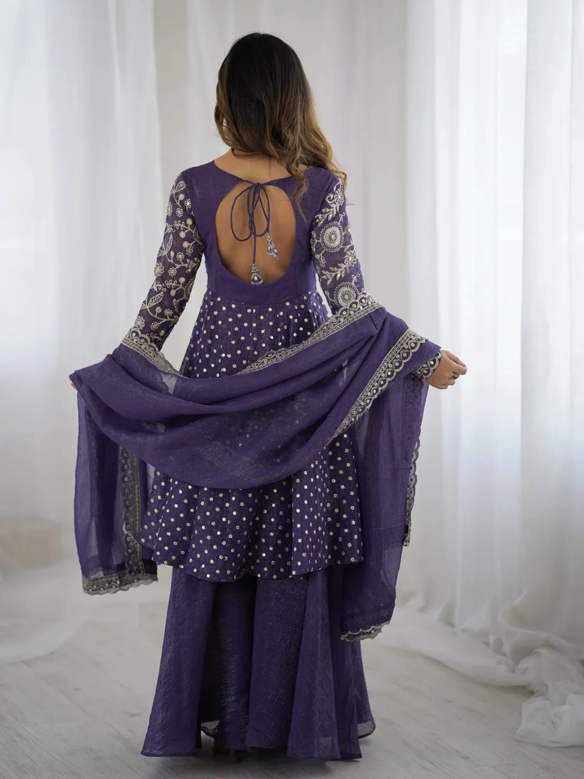Tarani purple silk dress back view showing stylish tie design and dupatta border