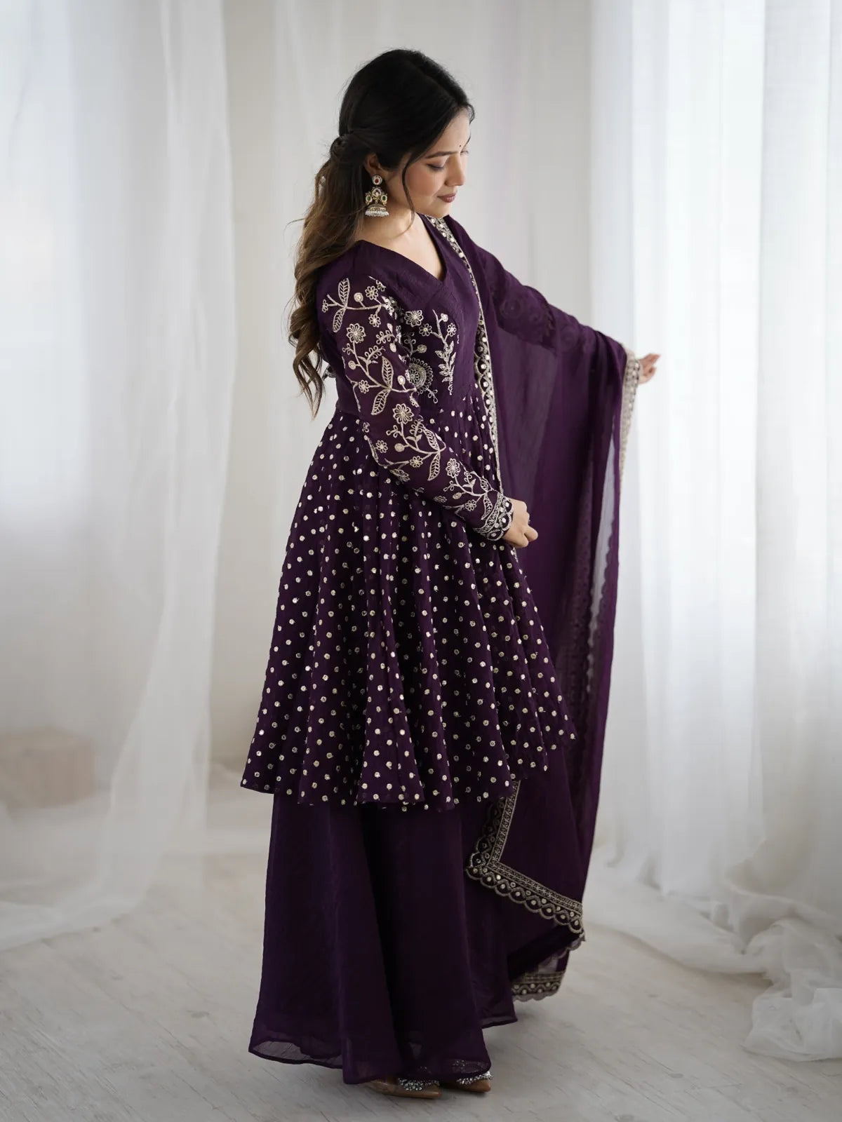 Tarani premium purple silk side pose showcasing embroidery and flow