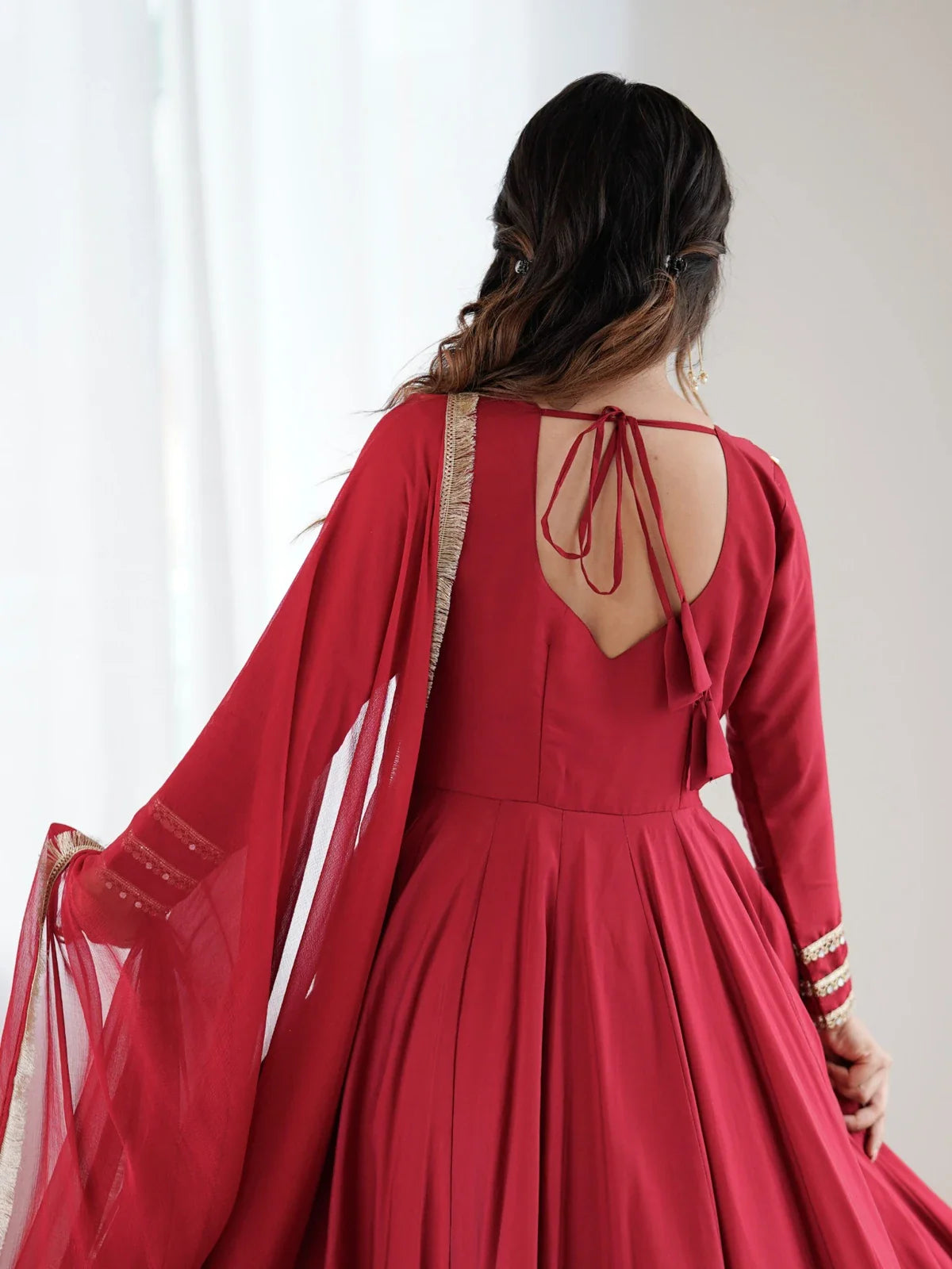 Tarani red Roman silk Anarkali gown back view with tie-up design and flowy silhouette