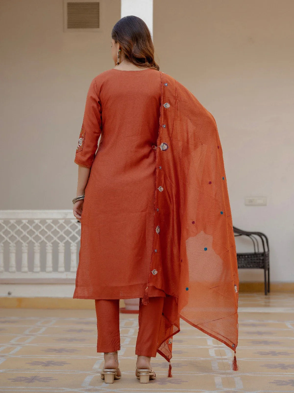 Tarani rust kurti set with dupatta shown from the back in full length view
