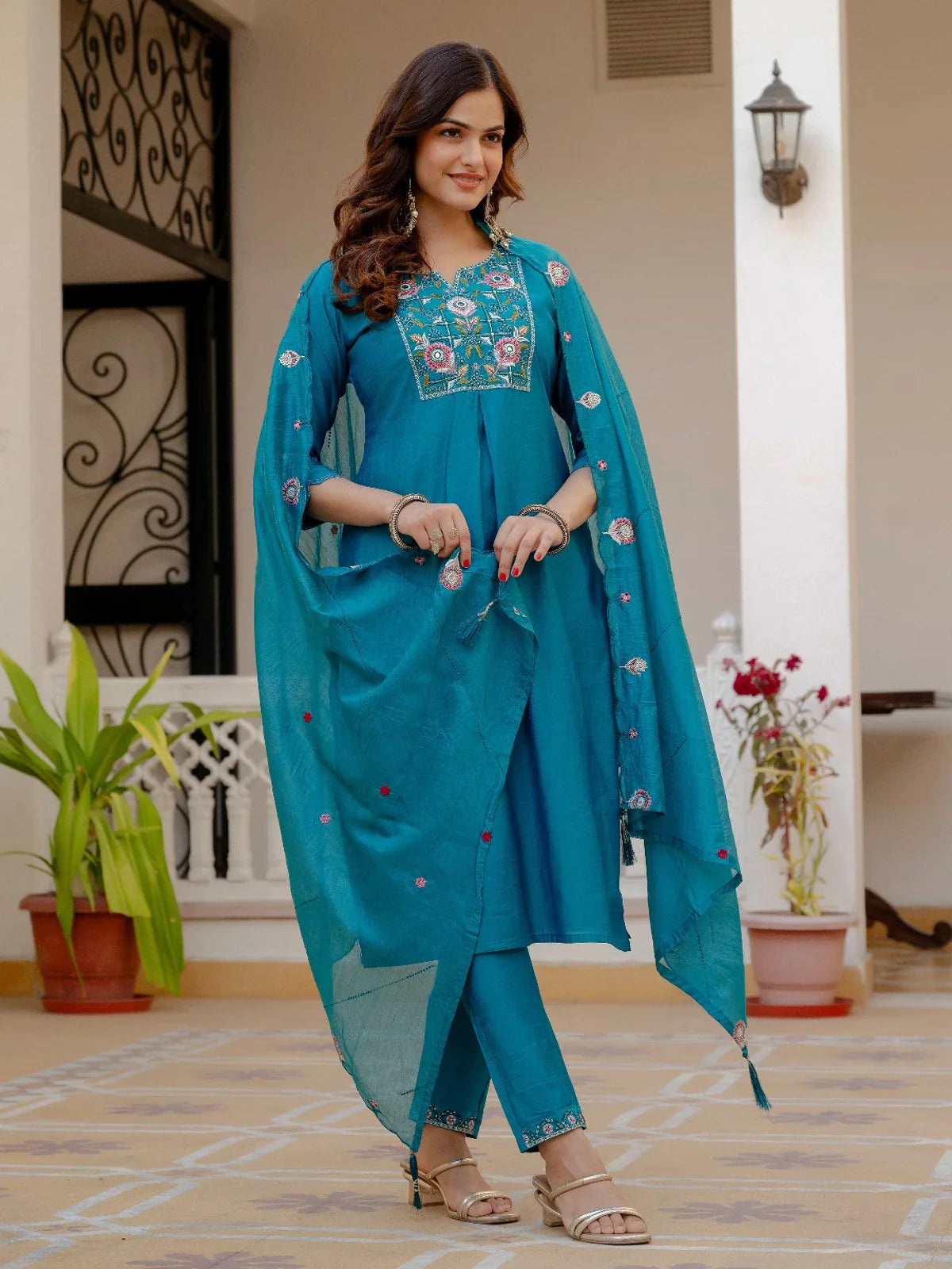 Tarani full view of teal silk dress set with elegant dupatta and festive pant detailing