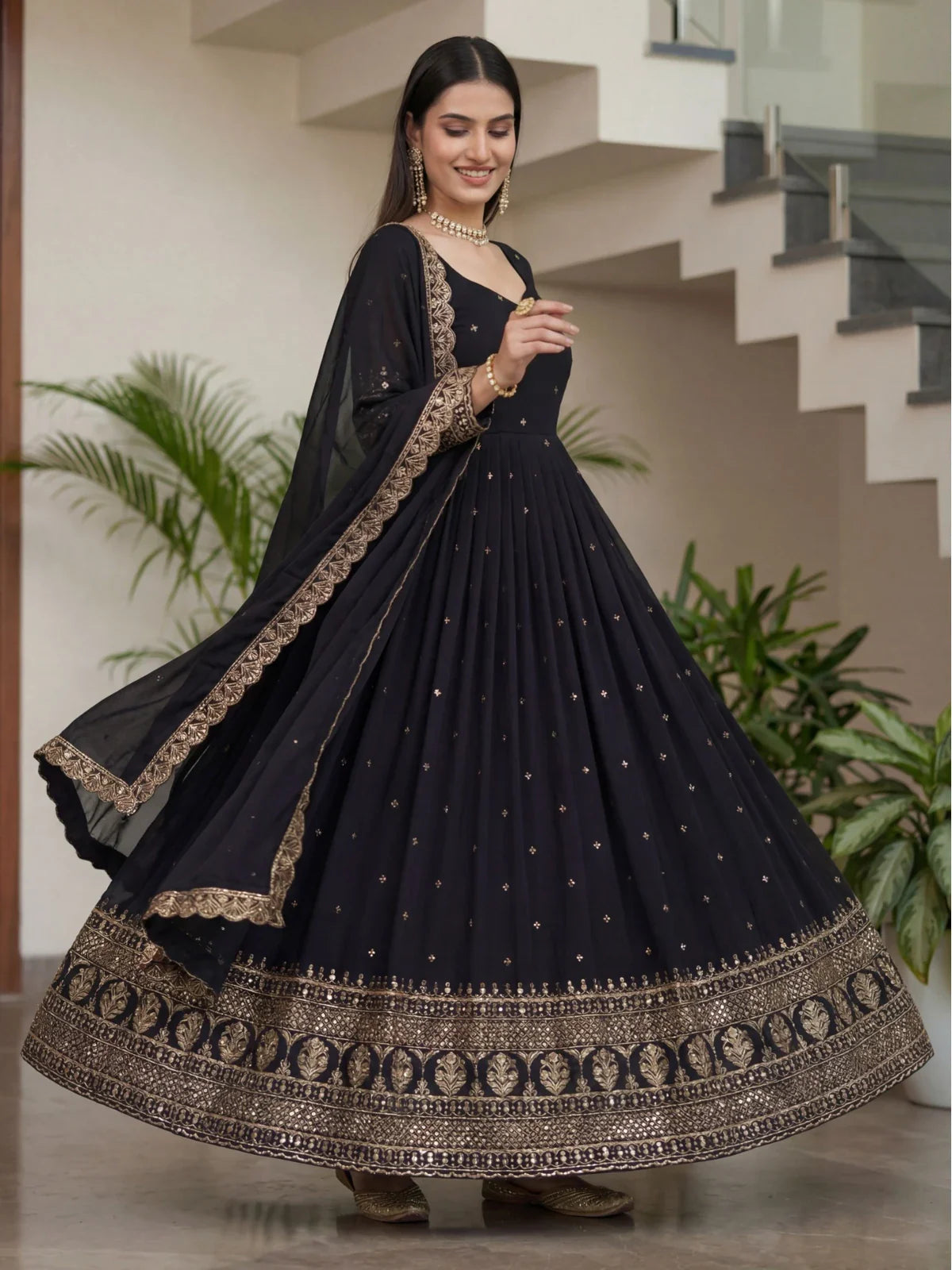 Tarani designer black silk gown front pose highlighting embroidery and flow