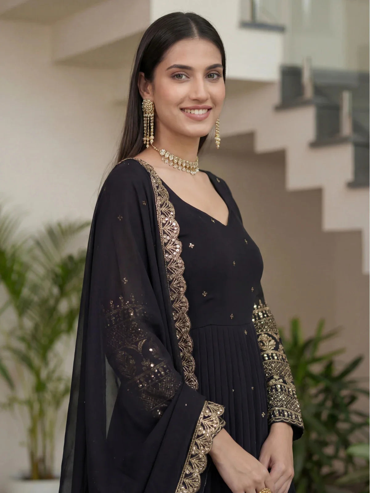 Tarani elegant black silk gown upper body view showing neckline and sleeves