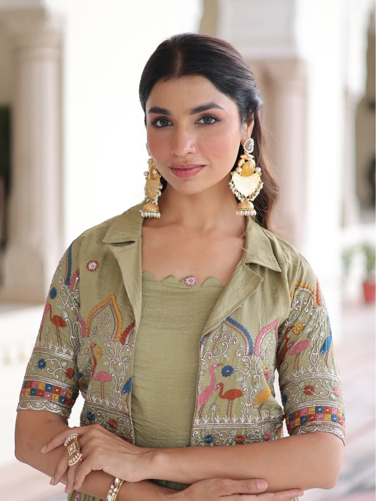 Tarani elegant green silk gown upper body close-up showing embroidered koti and neckline