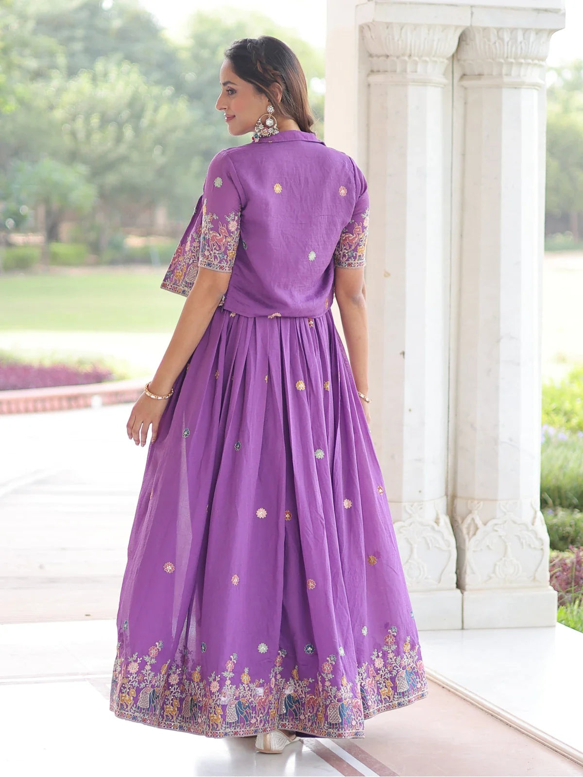 Tarani back view of purple embroidered gown with detailed koti and soft pleated drape - Ashwika