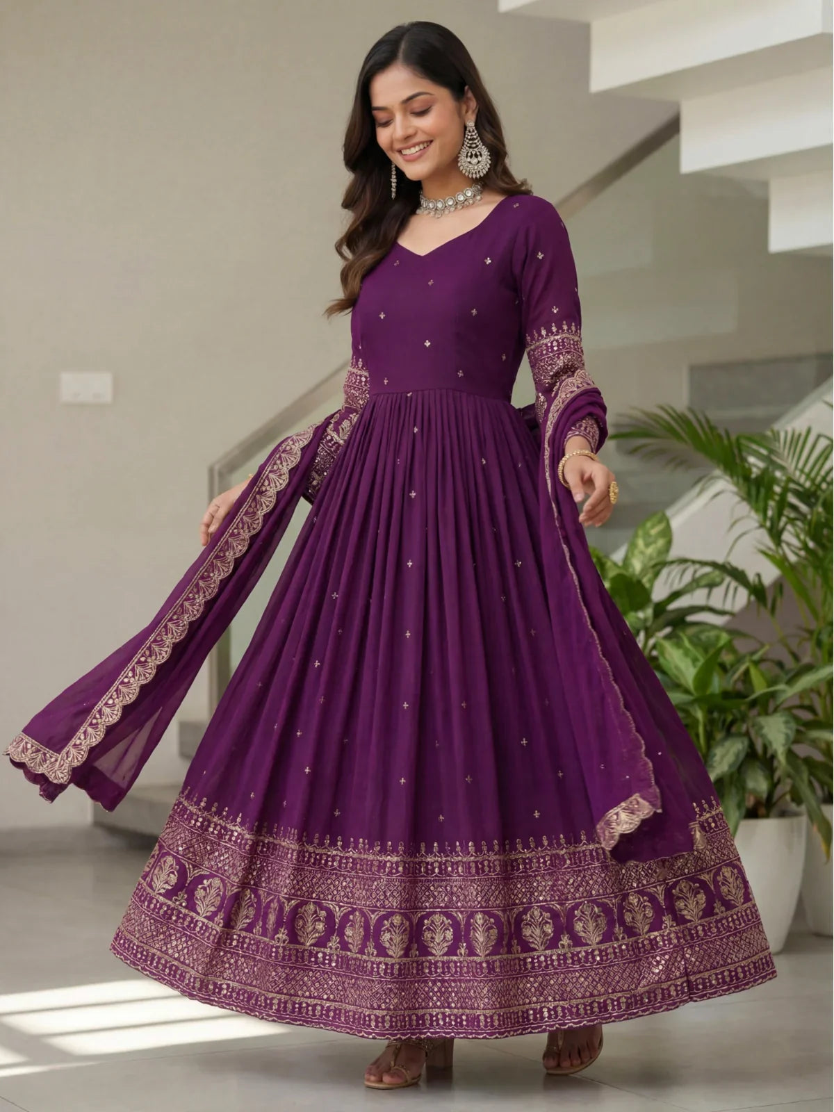 Tarani front view of purple embroidered silk gown with elegant pleats and ethnic styling