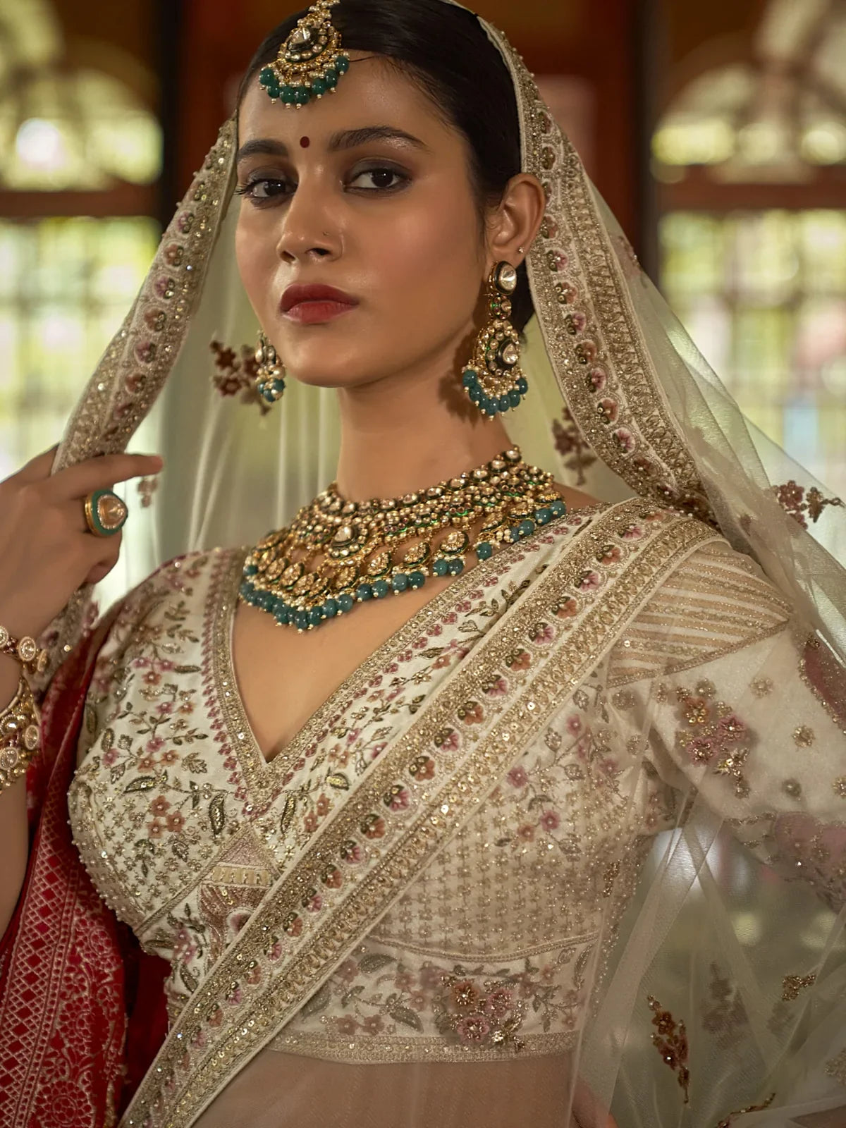 Tarani bridal beige silk lehenga upper body view with embroidered blouse