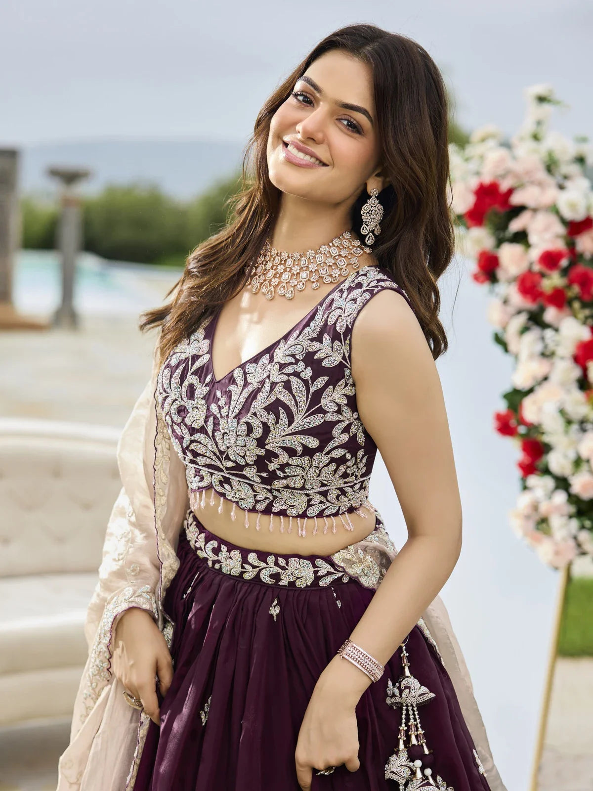 Tarani black satin silk lehenga upper body view with embroidered blouse and jewellery styling