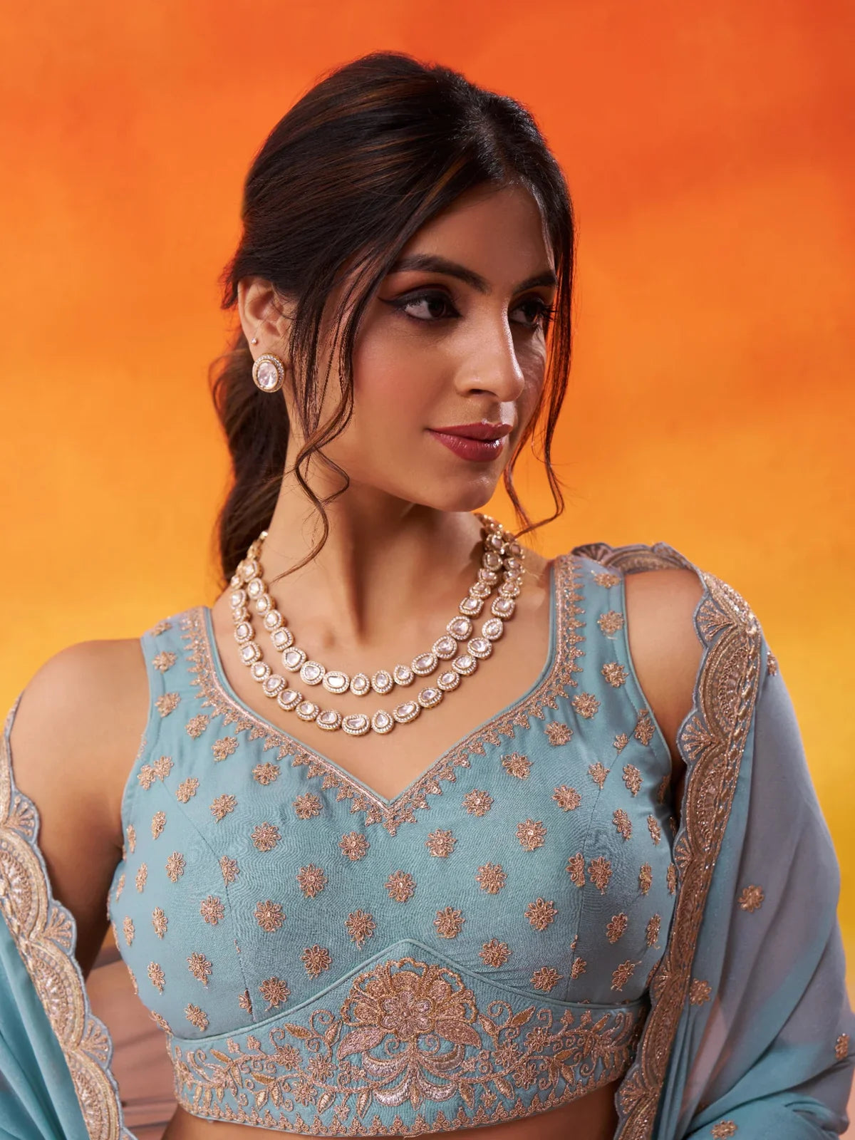 Tarani close-up of blue lehenga blouse with sweetheart neck and sequin embroidery work