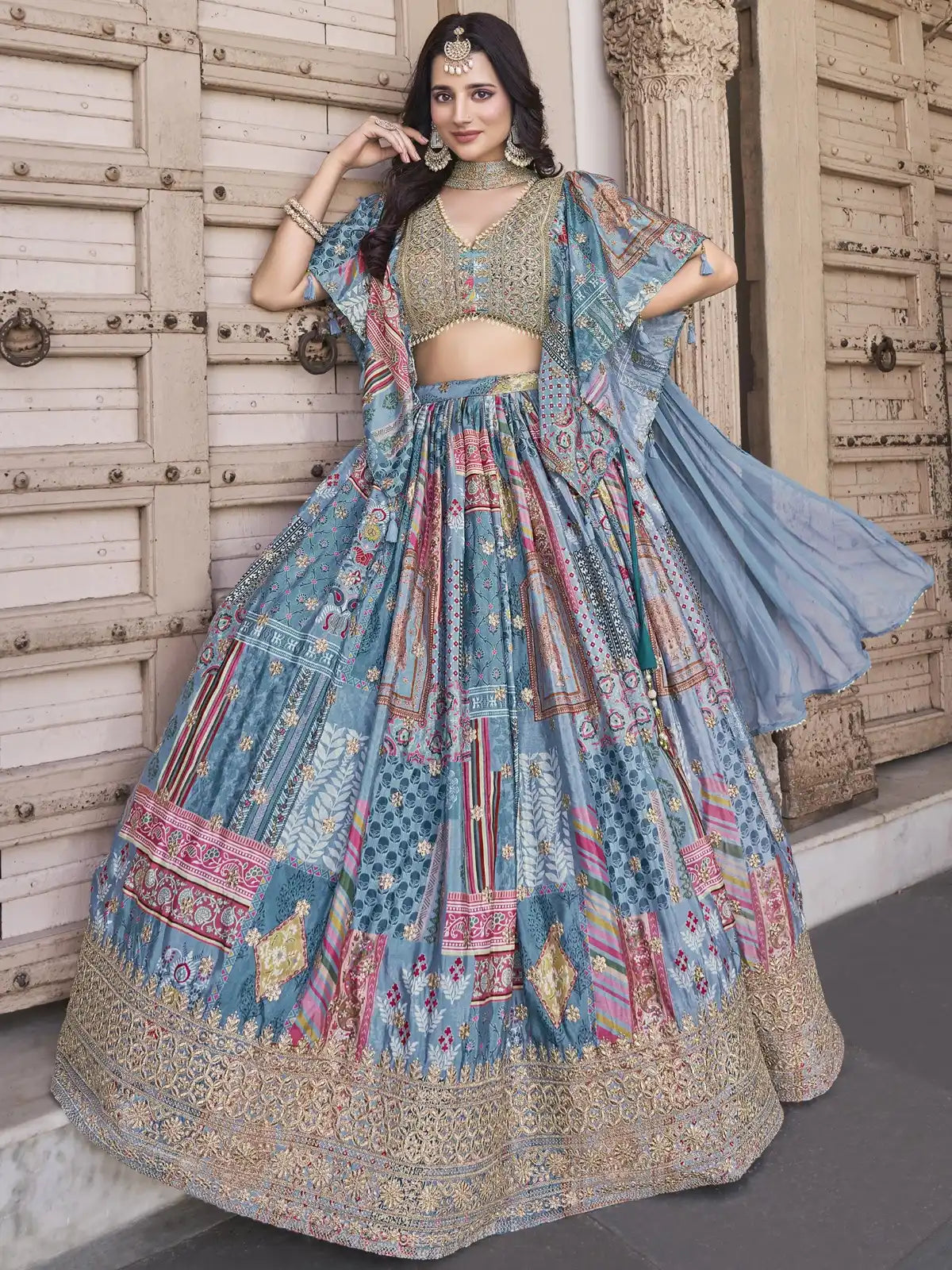 Tarani premium blue silk lehenga with multicolor embroidery, full view with zari border and blouse for weddings