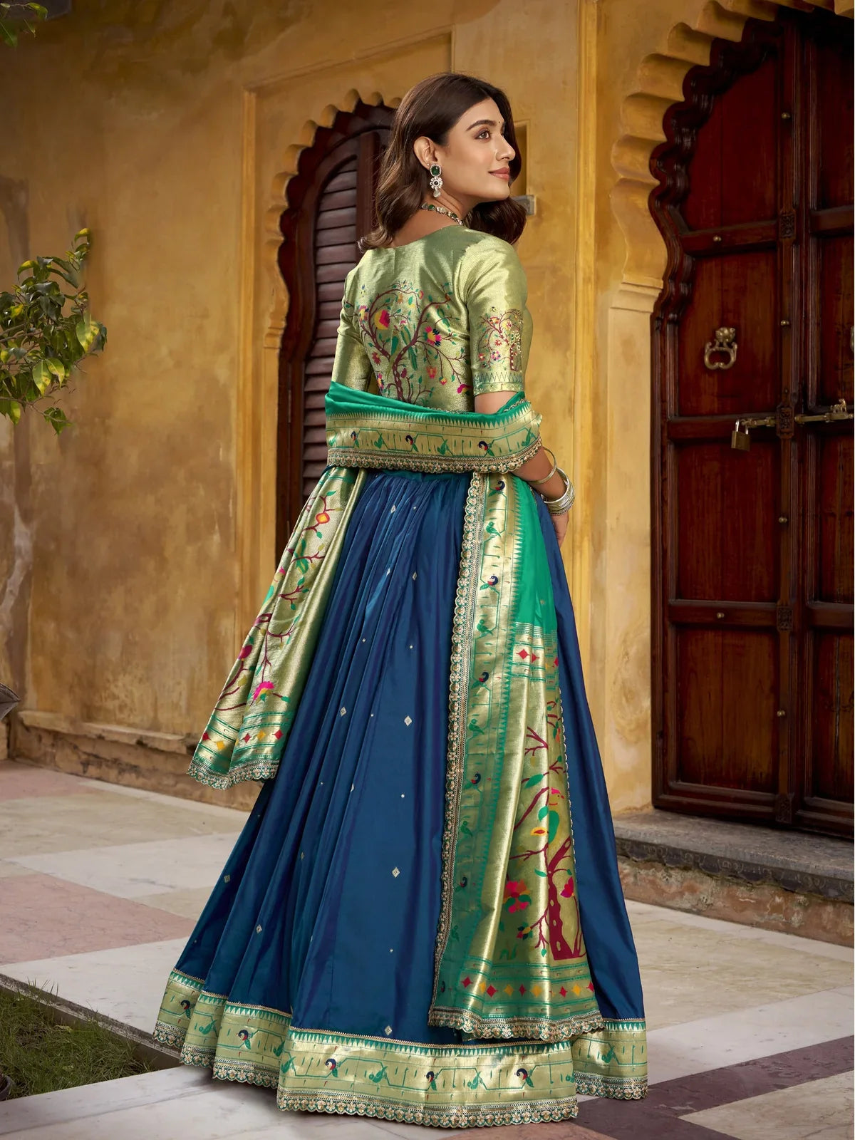Tarani green lehenga back view showing dupatta and blouse embroidery in detail