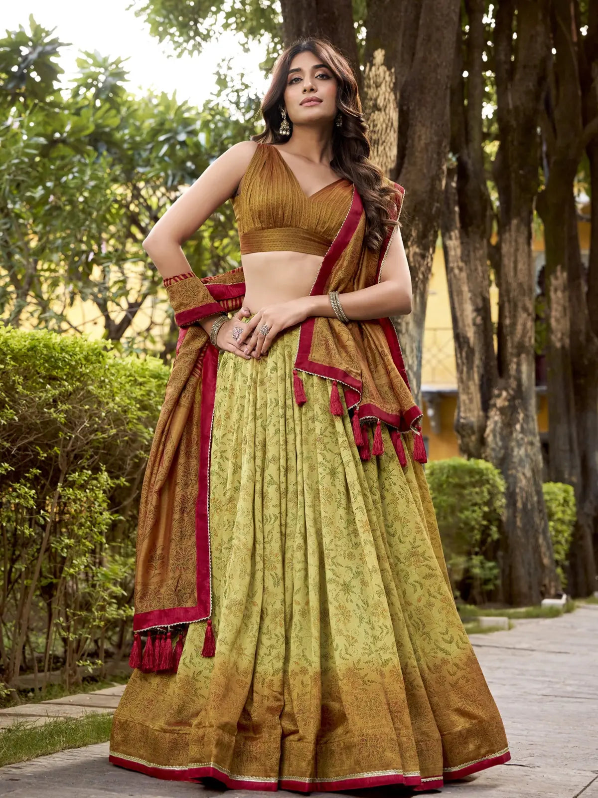 Tarani festive green silk lehenga with mustard printed dupatta and deep V blouse front full view