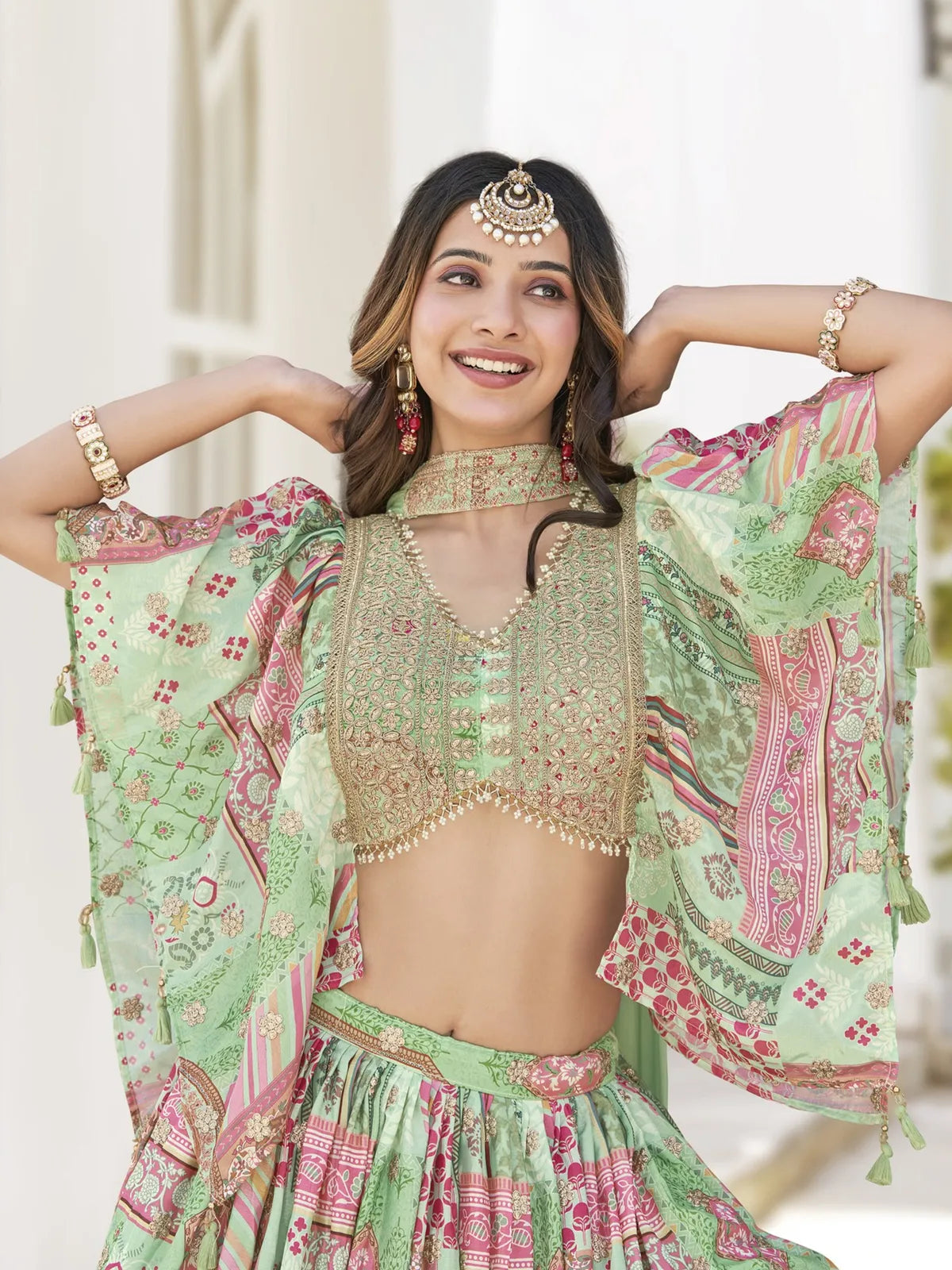 Tarani green silk lehenga blouse and dupatta close-up with embroidery detailing
