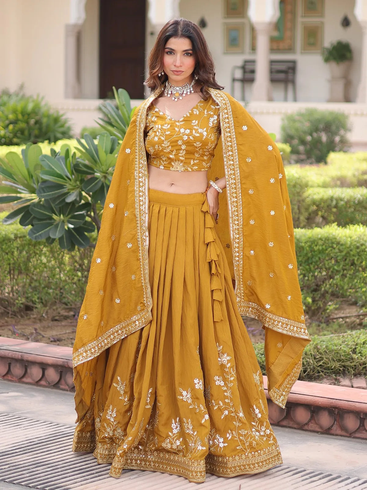 Tarani mustard silk lehenga with floral embroidery, stitched flair and matching blouse with dupatta