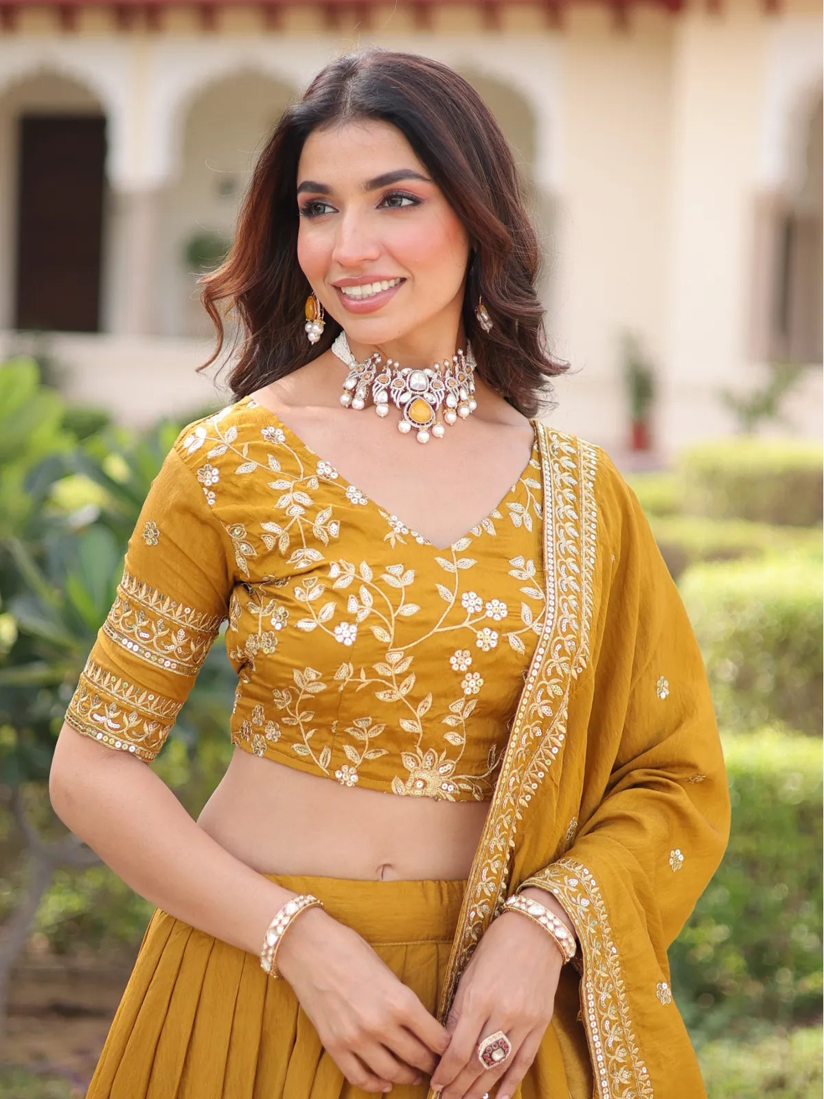 Tarani mustard embroidered blouse closeup with neckline detail and designer sleeves