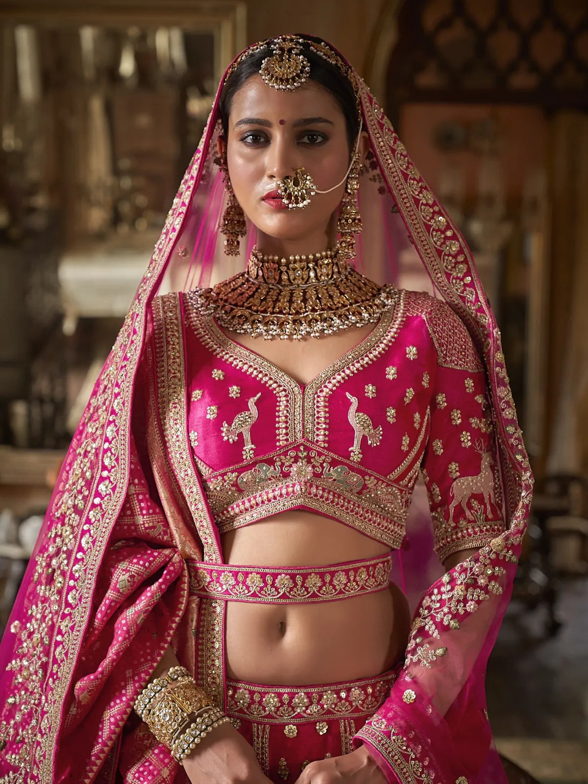 Tarani premium pink silk bridal lehenga with embroidered blouse upper body view