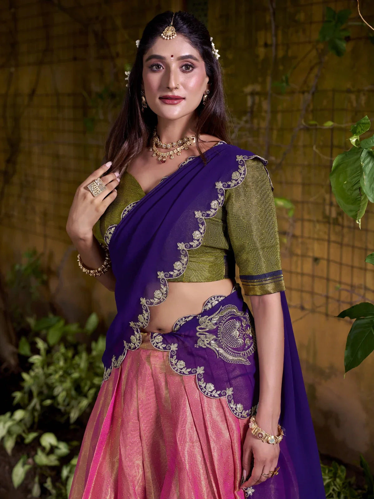 Tarani green blouse with zari work and purple dupatta with golden embroidery upper body closeup