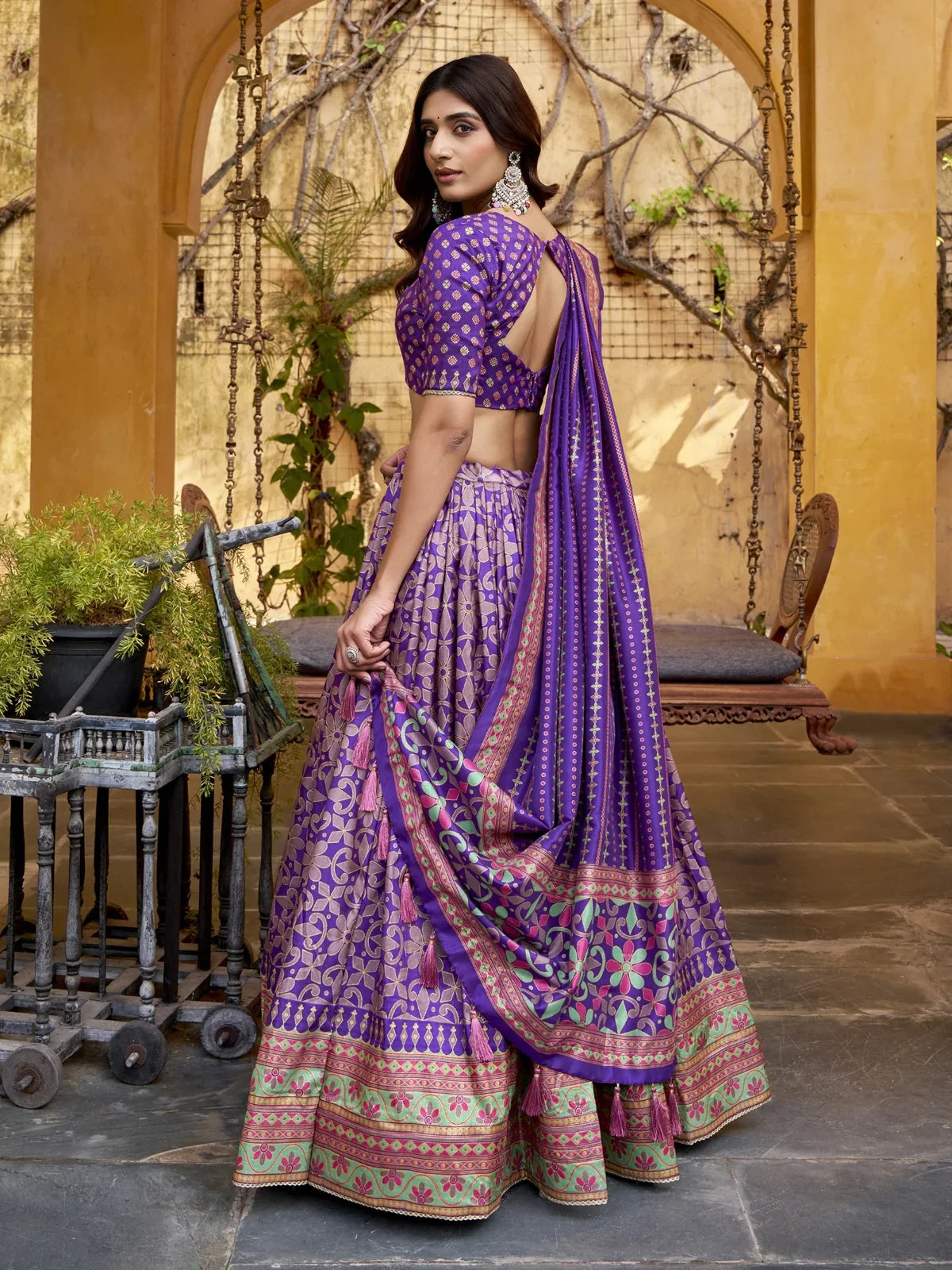 Tarani silk lehenga back view with blouse tie-up and full ghera detailing for cultural gatherings