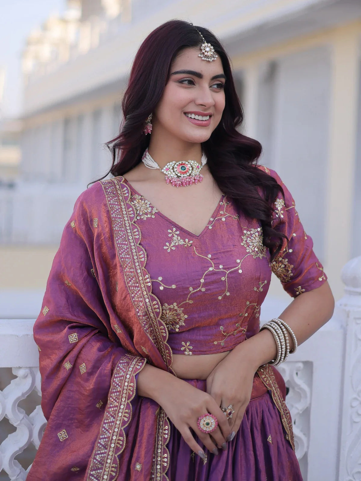 Tarani purple lehenga close-up showing blouse embroidery and jewelry styling