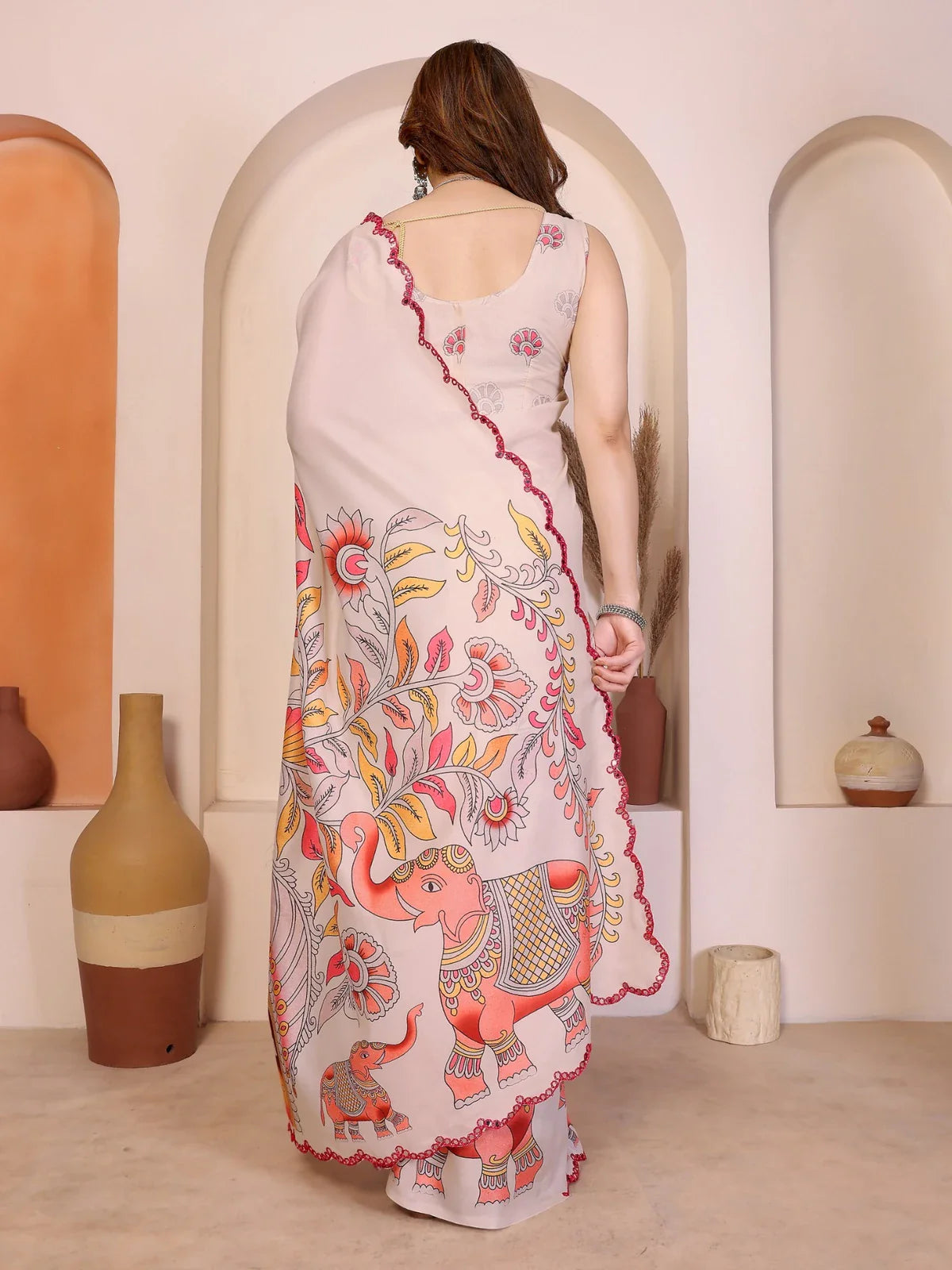 Tarani back view of kalamkari Manipuri silk saree showing elephant motifs and mirror work finish