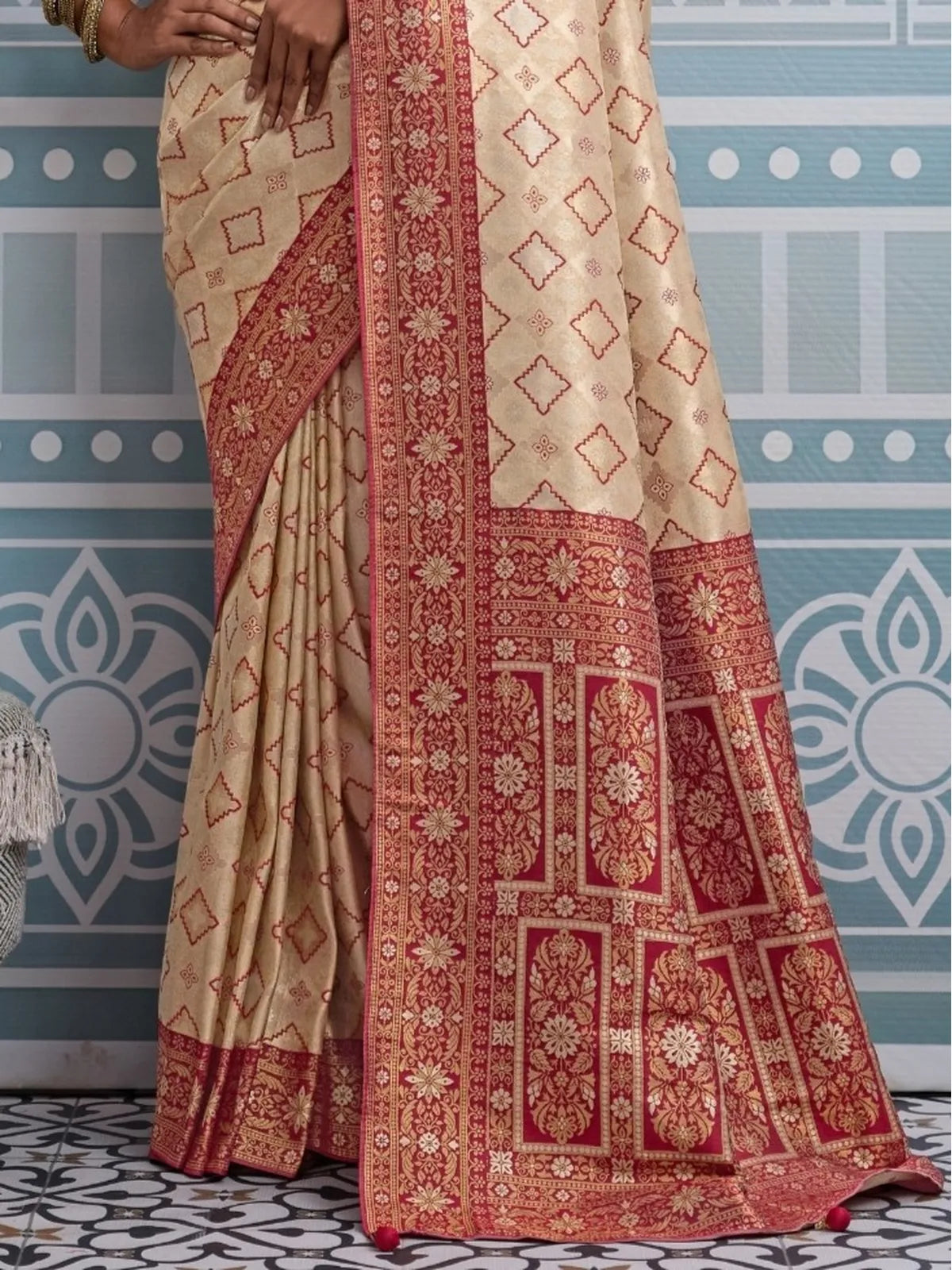 Tarani beige silk saree closeup view showing zari thread and intricate meenakari details