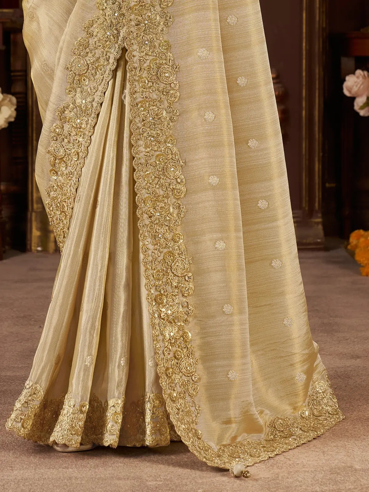 Tarani soft beige saree with embroidered border and heavy latkan on pallu