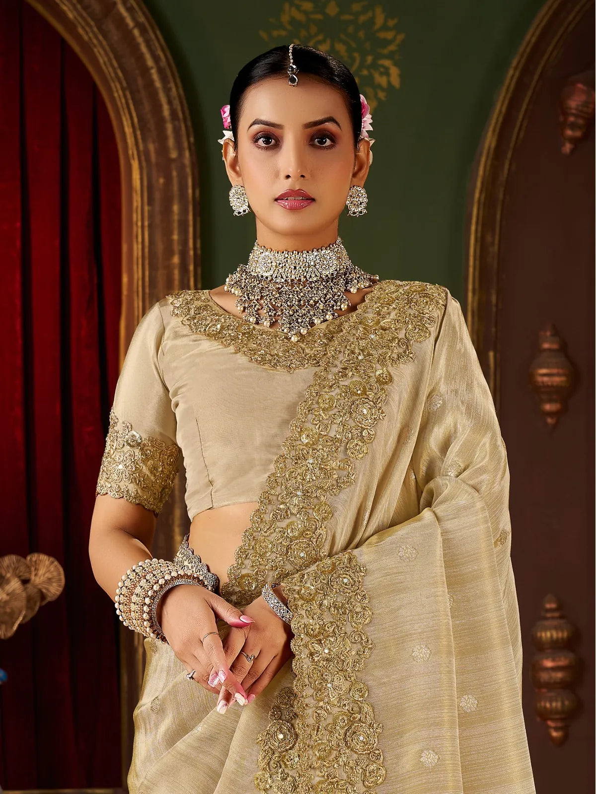 Tarani beige zari embroidered saree with blouse close-up in upper body pose
