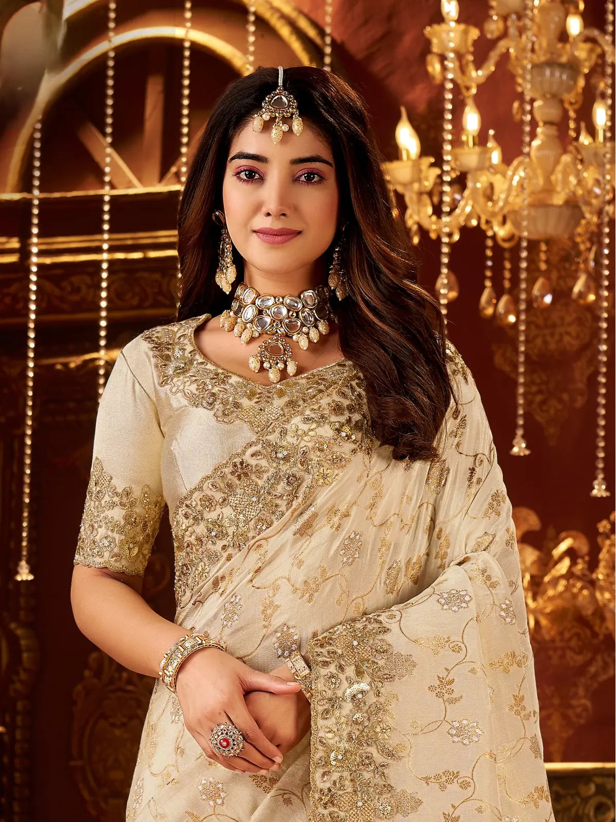 Tarani upper body view of beige silk saree with floral embroidery and jewellery styling