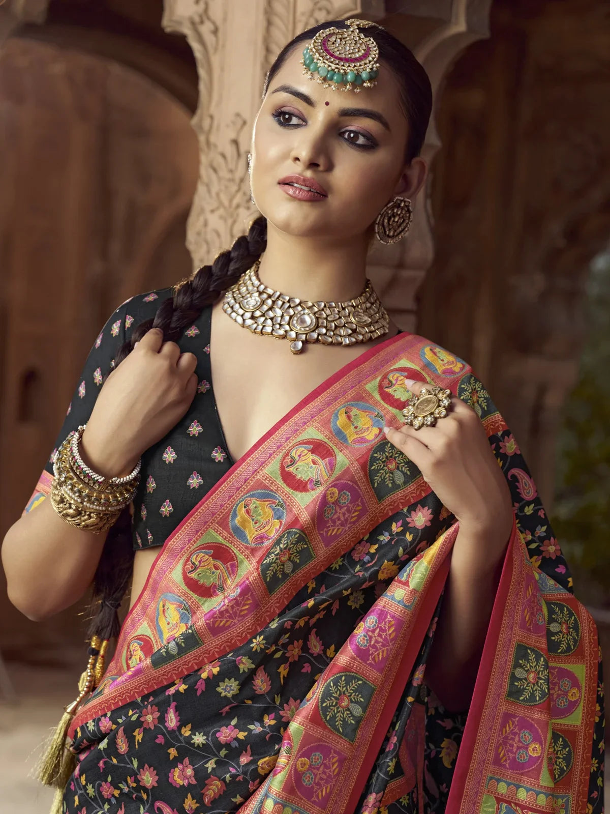 Tarani premium black silk saree upper body view highlighting intricate blouse and border work