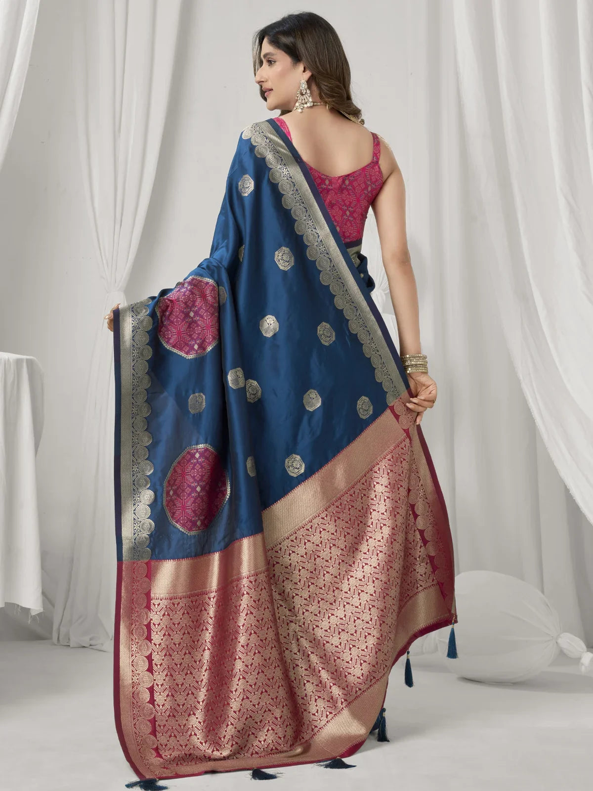 Tarani back view of soft silk saree with tassels and traditional blouse