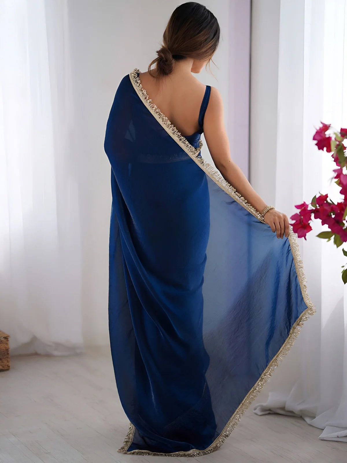 Back view of Tarani deep blue space silk saree showcasing elegant lace border
