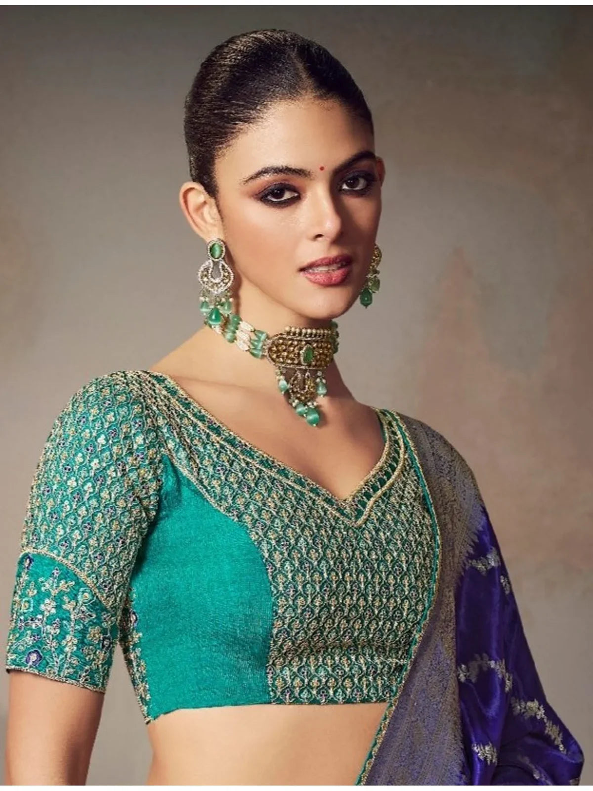 Tarani blue embroidered blouse in designer work paired with chiniya silk saree for premium festive wear