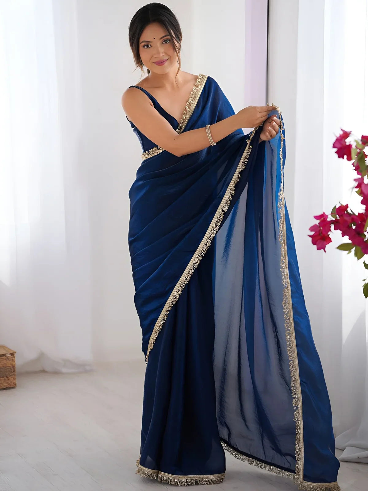 Tarani elegant blue silk saree with sequin lace border and blouse in front view