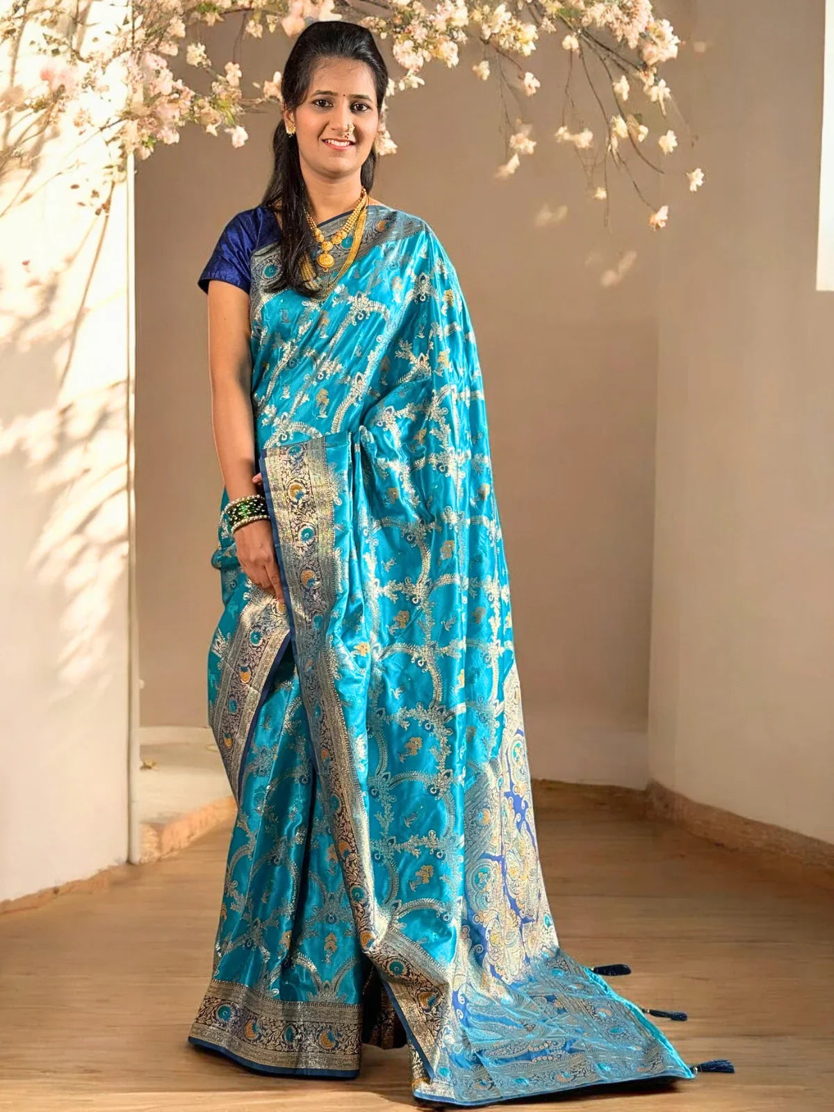 Tarani premium blue woven silk saree full view with golden zari border