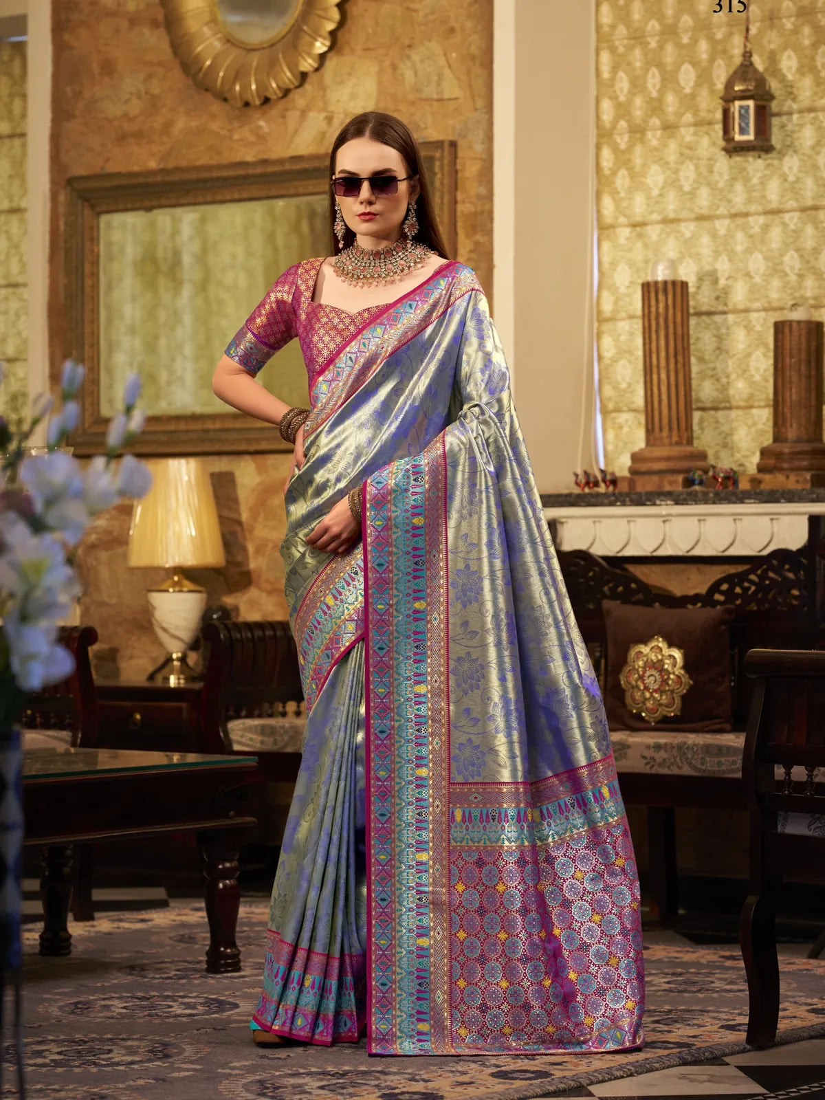 Tarani elegant blue silk saree full view with woven border and contrast blouse