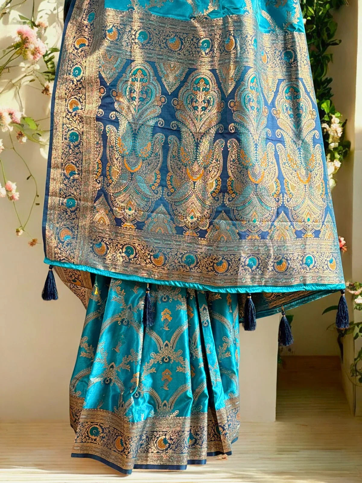 Tarani elegant blue silk saree front view with woven motifs and golden border