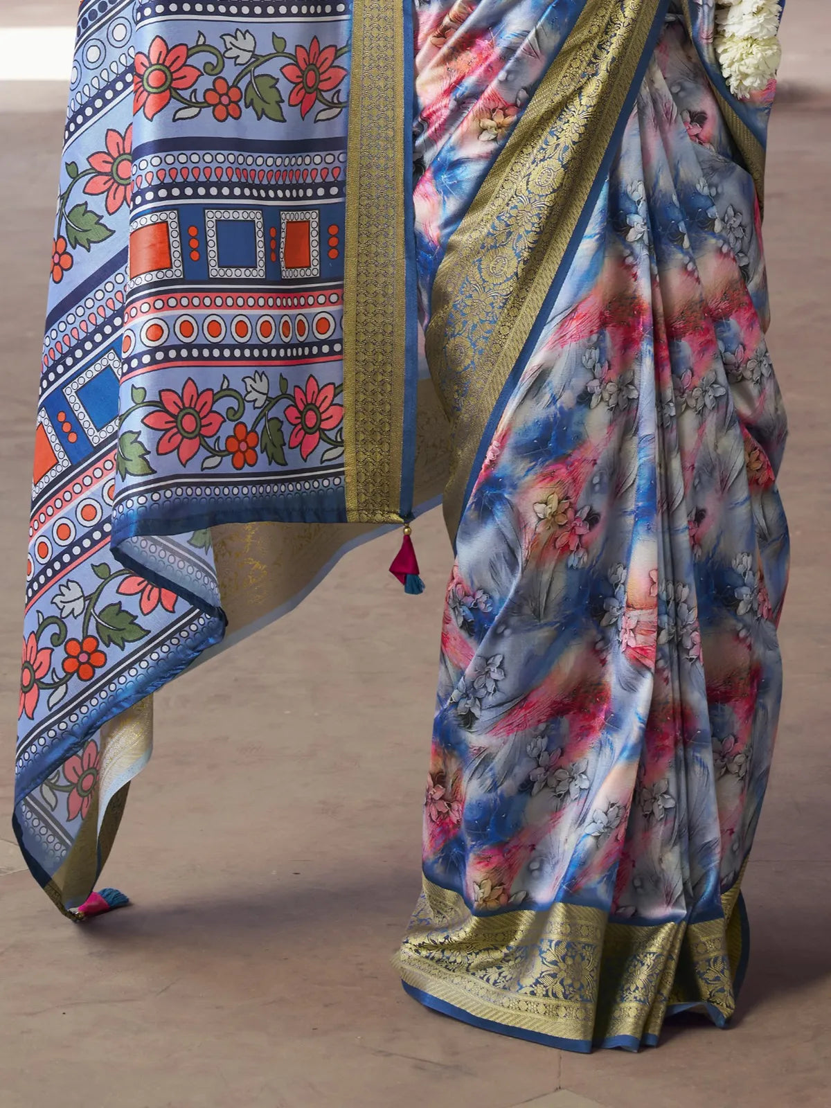 Tarani blue silk saree pallu view with tassels and intricate embroidery