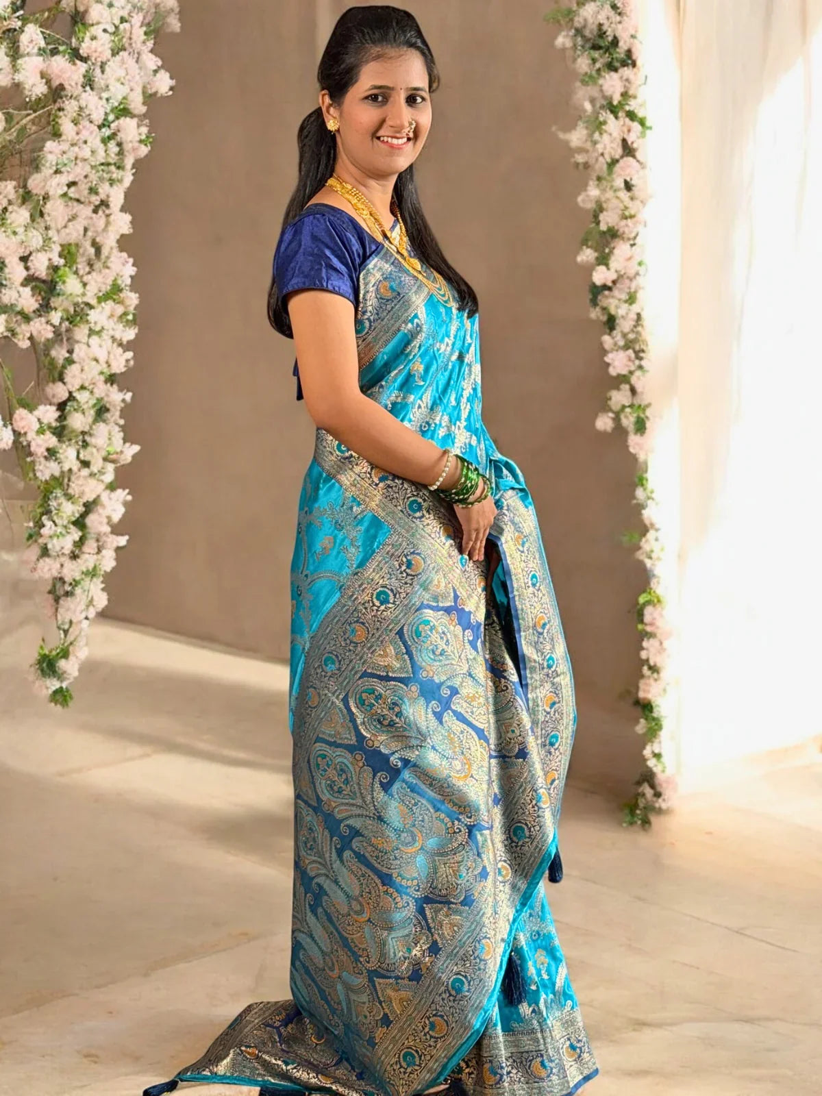 Tarani blue silk saree pallu view with intricate paisley zari design