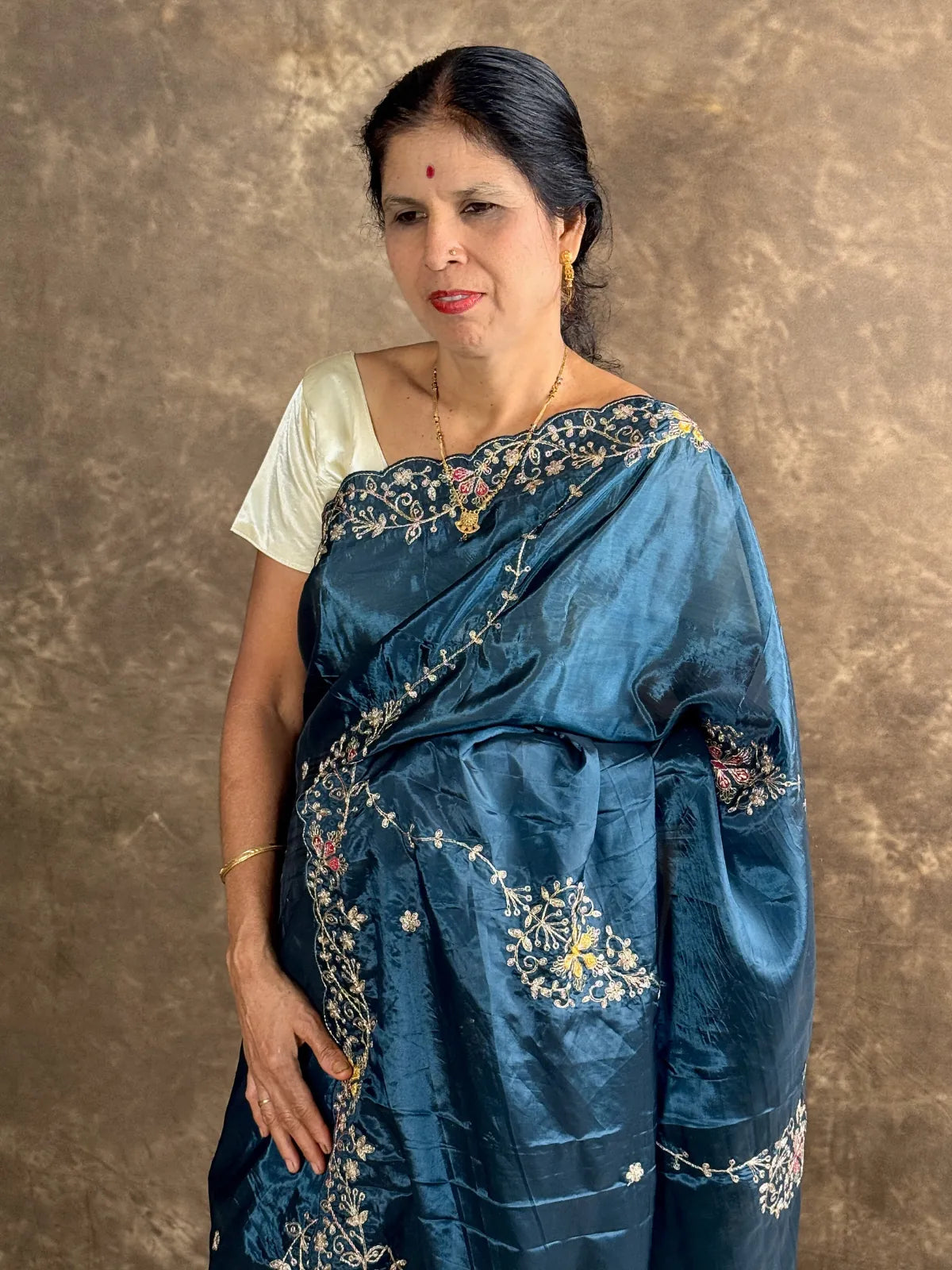 Tarani teal silk saree upper body view highlighting blouse and embroidery details