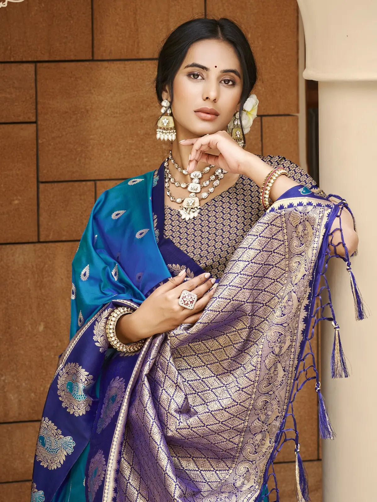 Tarani upper body view of model wearing deep blue silk saree with heavy blouse and jewellery