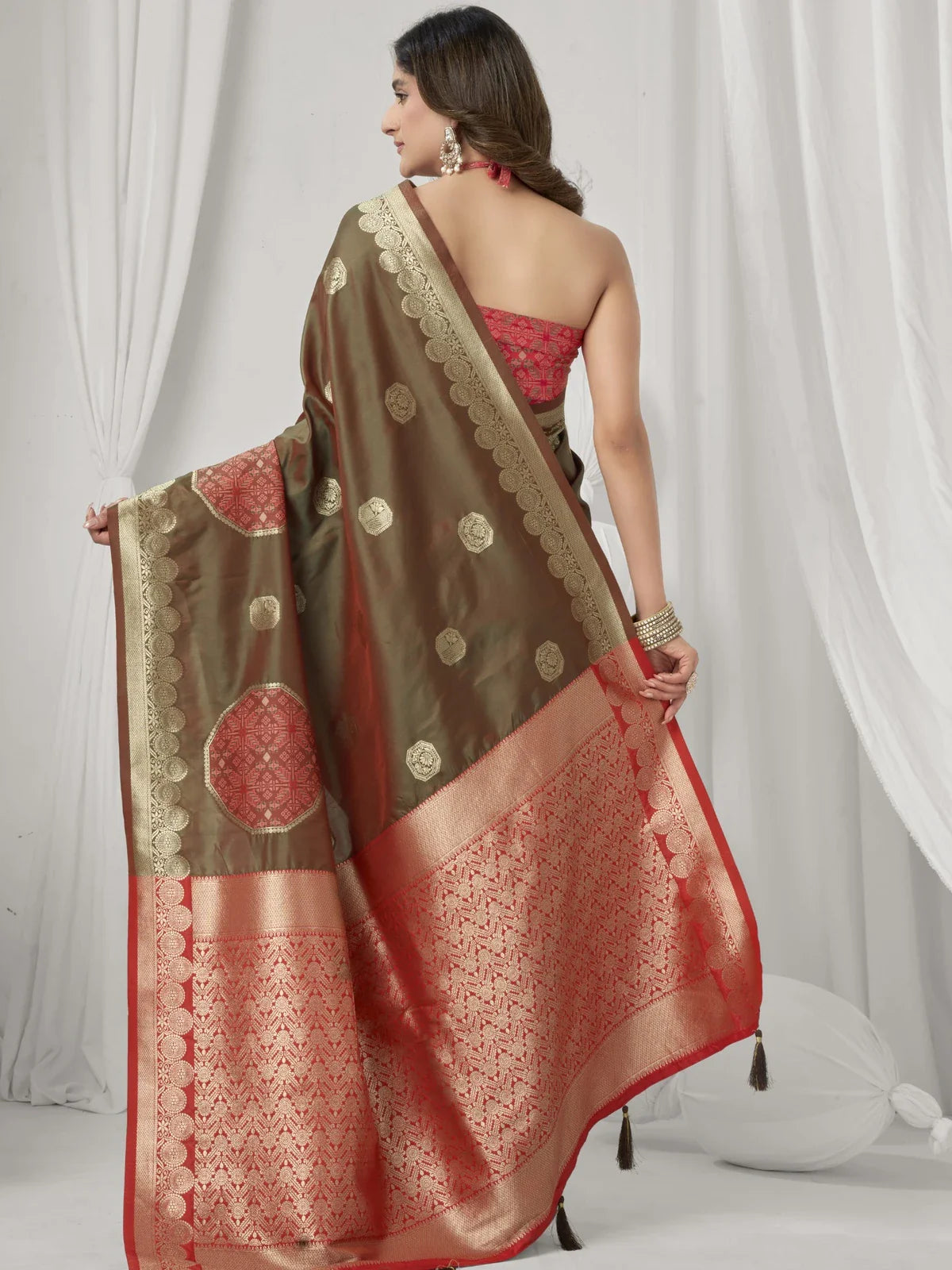 Tarani brown saree back view with soft fabric drape and festive weaving detail from Tarani