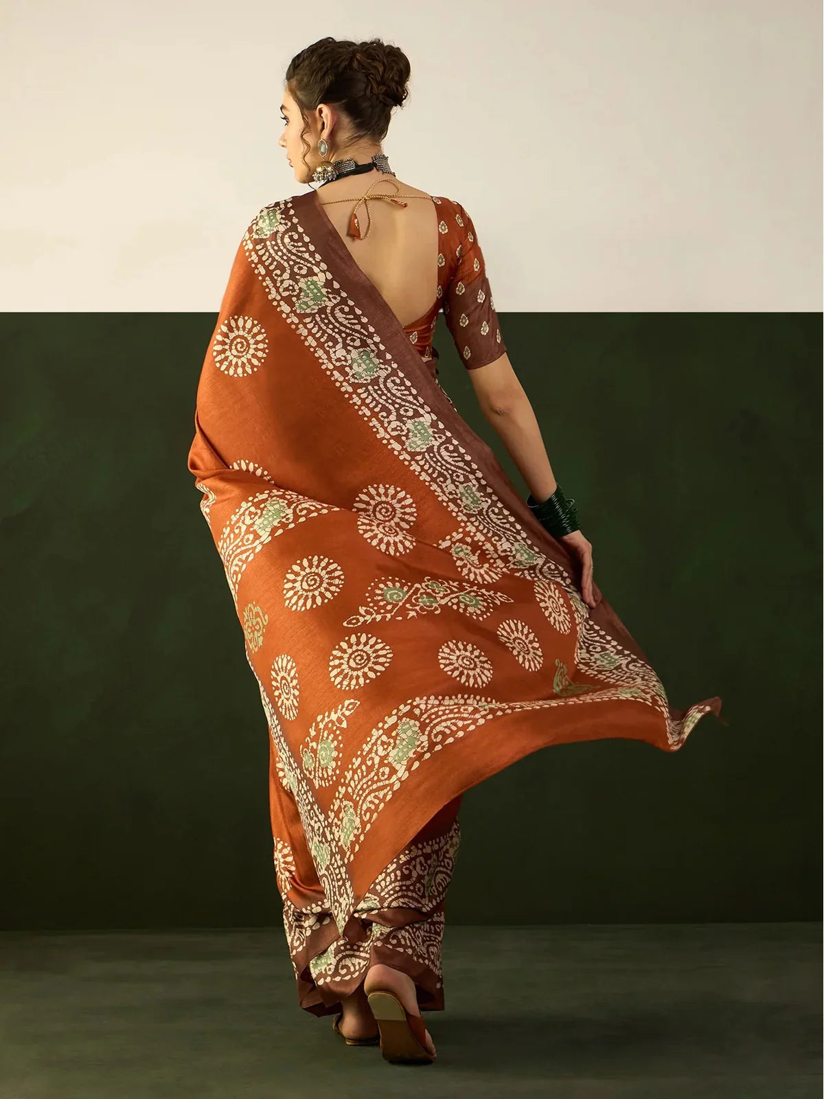 Tarani brown Dola silk saree full back view highlighting pallu and traditional border design