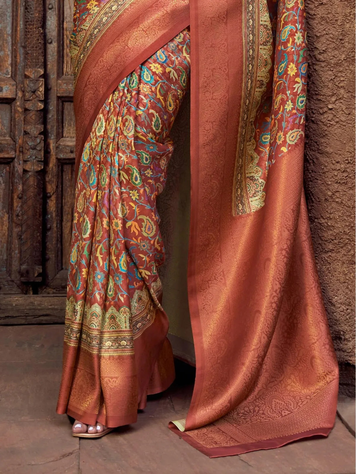 Tarani traditional silk saree in brown tone with vibrant ethnic motifs and zari work