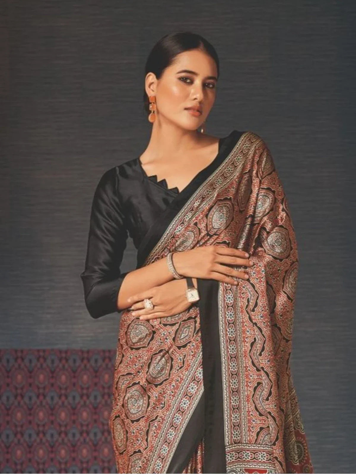 Tarani brown silk saree upper body view with elegant black blouse and traditional motifs