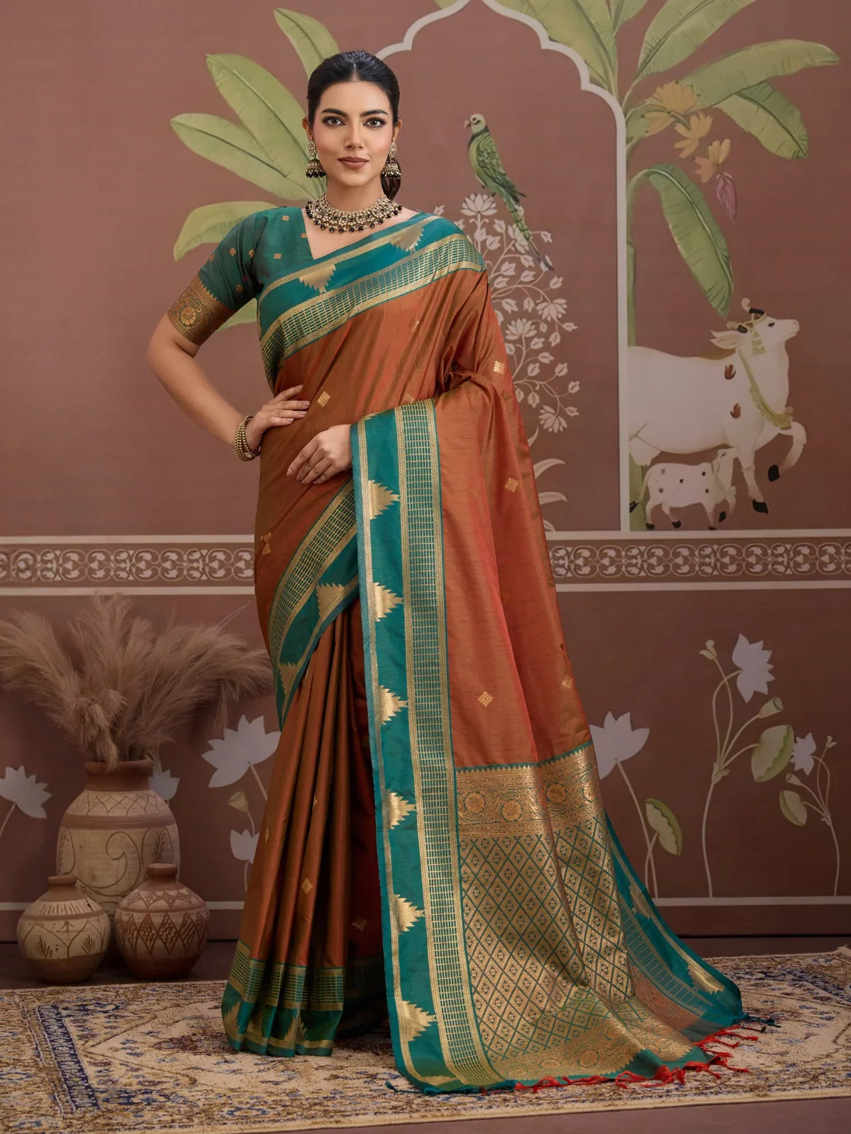 Tarani rich brown silk saree with contrast green zari border and traditional motifs full view