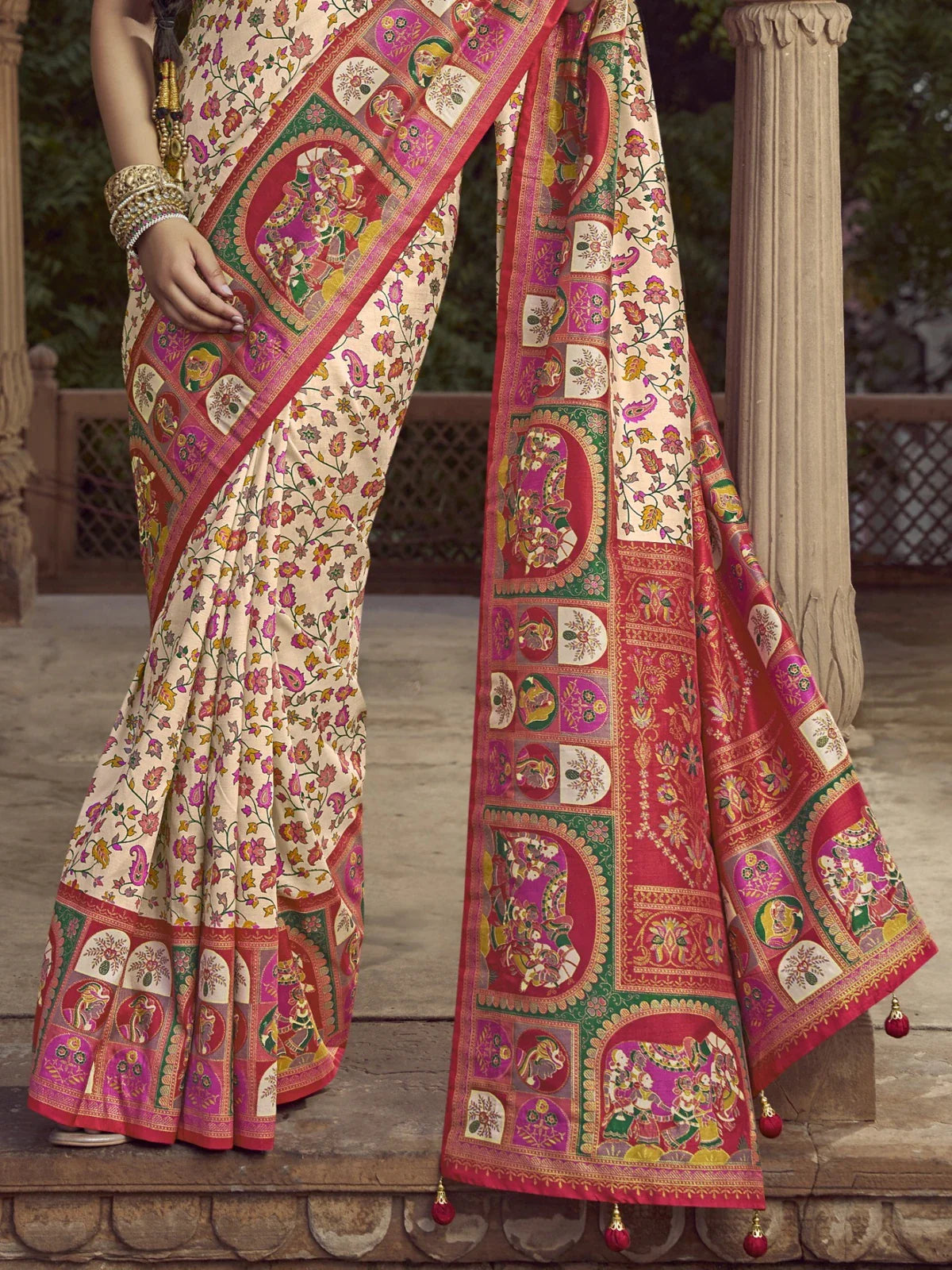 Tarani cream silk saree pallu view with intricate pink and green border design
