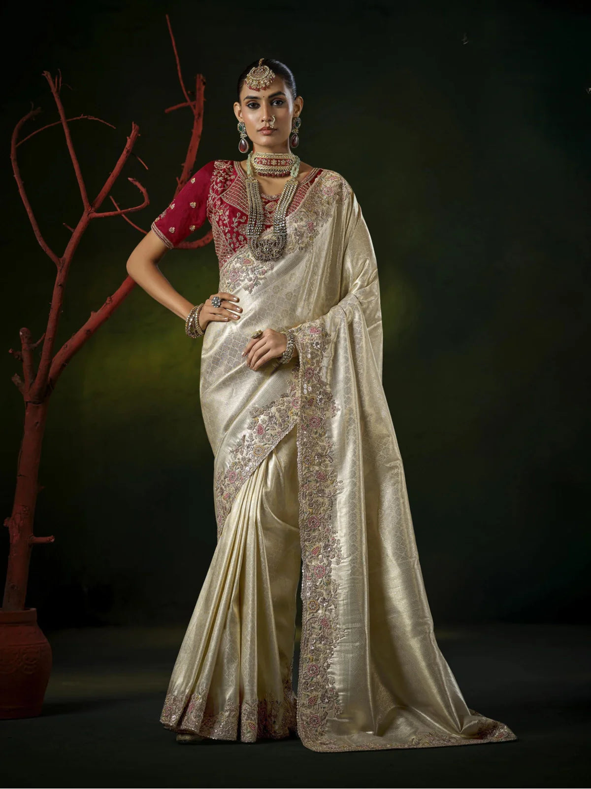 Tarani golden silk bridal saree with heavy embroidered border and maroon blouse full view
